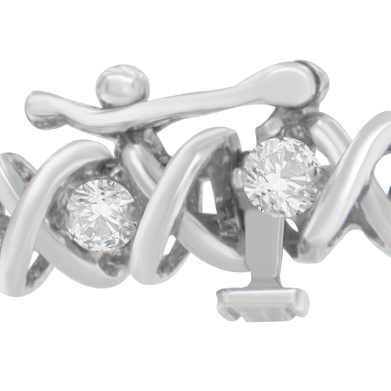 Apportez du charme à votre look éblouissant en portant ce séduisant bracelet en diamants. Composé d'un riche or blanc 18 carats, le bracelet de style tennis est poli à la perfection pour briller de mille feux. Doté d'un lien en X, ce bracelet