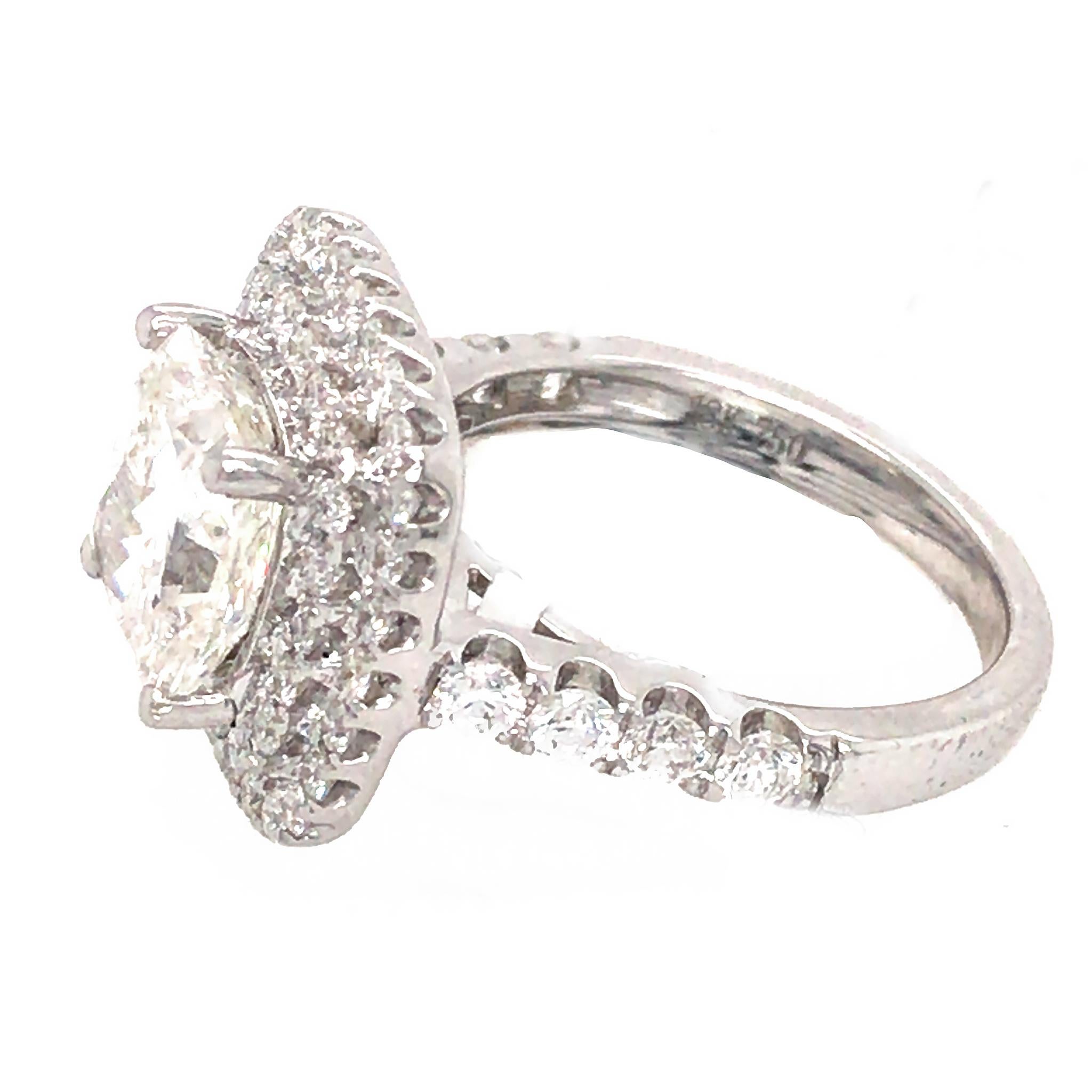18k White Gold
Diamond:  3.04 ct (center) 
Color: H
Clarity: SI2
Ring Size: 5.75
Total Weight: 6.82 grams