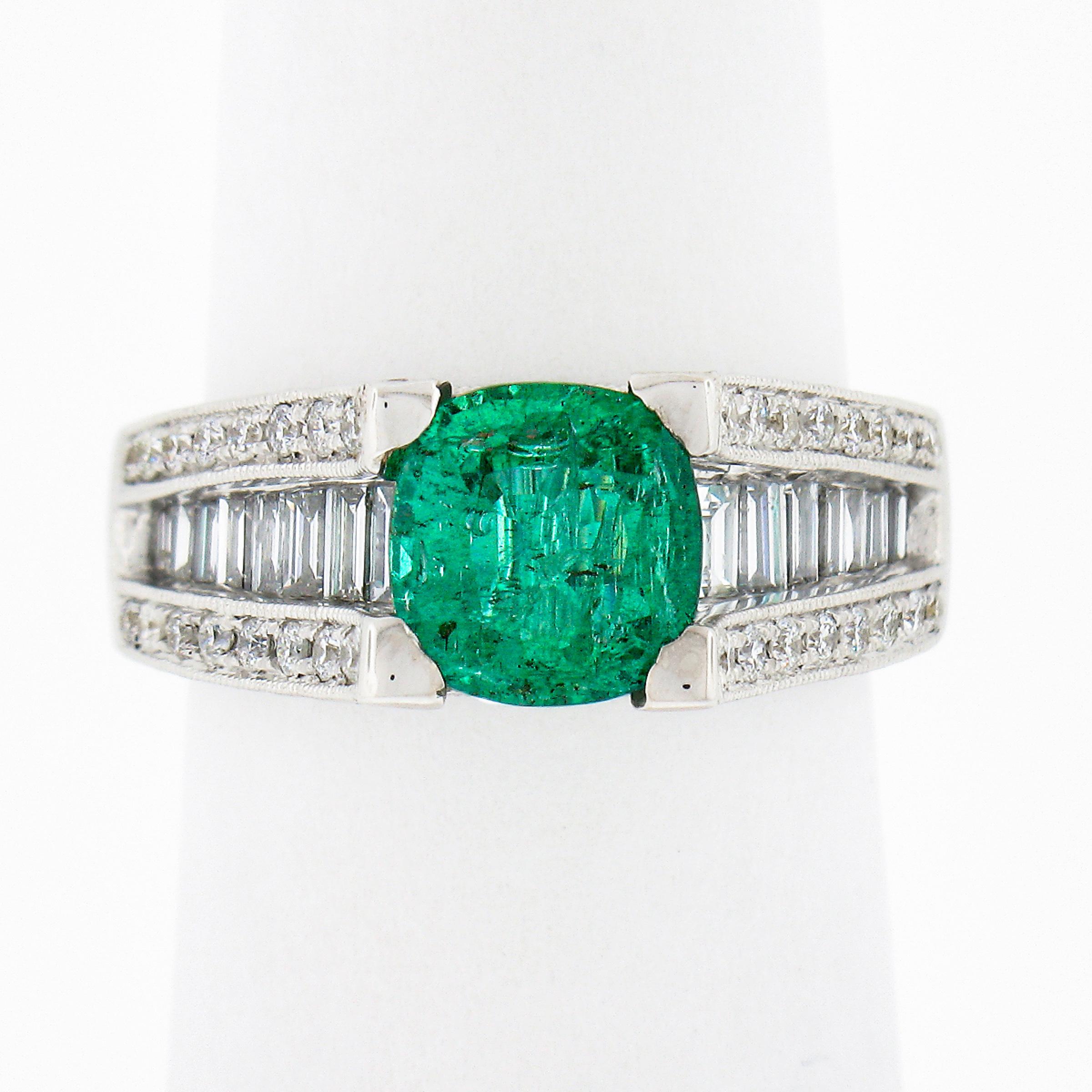 This breathtaking cocktail or engagement style ring is crafted from solid 18k white gold. It features a stunning, GIA certified, cushion cut emerald solitaire elegantly prong set above a magnificent channel of baguette cut diamonds. The emerald is a