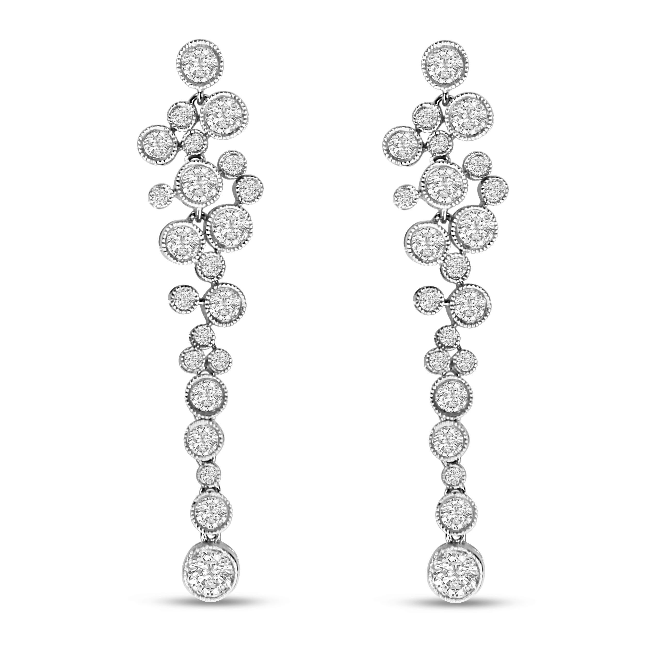 Drape yourself in the exquisite sparkle of these diamond waterfall earrings! A perfect statement piece for day or night, these dangle drop earrings are simply splendid in an array of round white diamonds of 3.15 total cttw in an approximate H-I