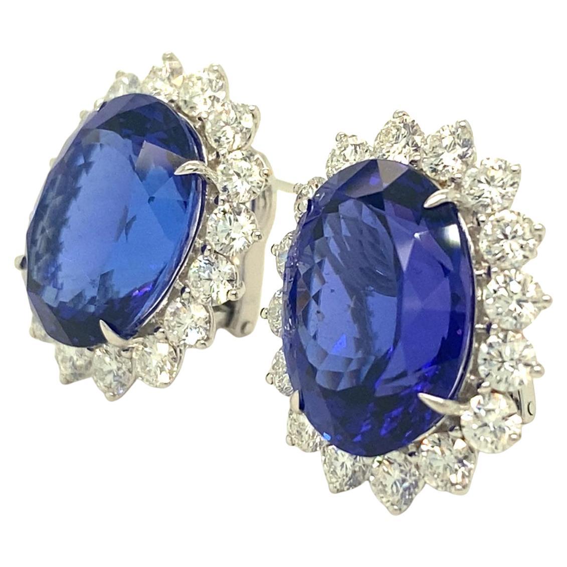 18k White Gold & 31.54ct Oval Tanzanite Huggie Earrings w/ 5.09ct Diamond Halo