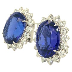 18k White Gold & 31.54ct Oval Tanzanite Huggie Earrings w/ 5.09ct Diamond Halo