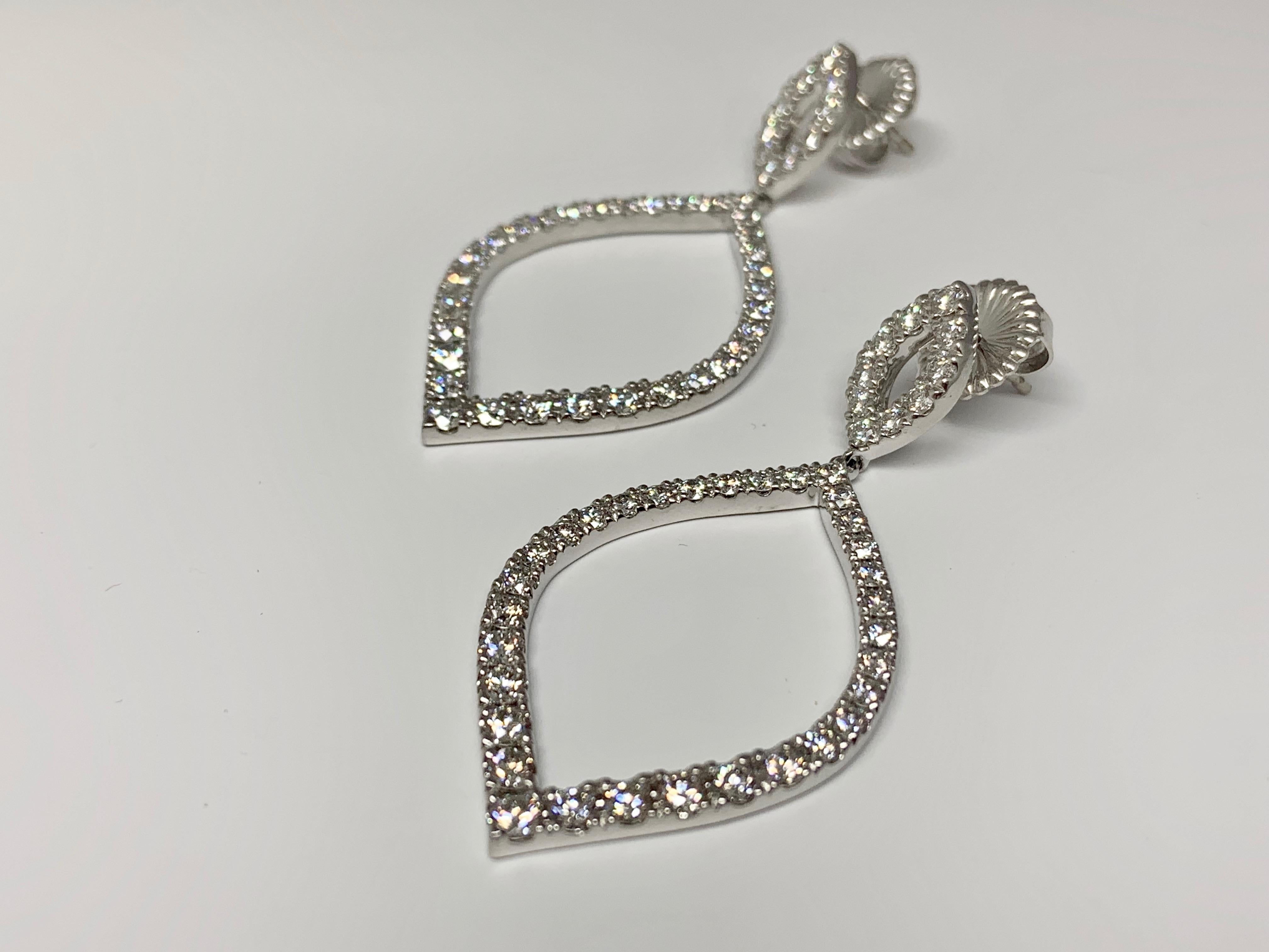 Hearts On Fire Provocative 3.43 carat round diamond drop earrings set in 18K white gold. These earrings are bold, beautiful, and perfect for events, weddings, or special occasions. This item will ship with a Hearts On Fire Certificate of