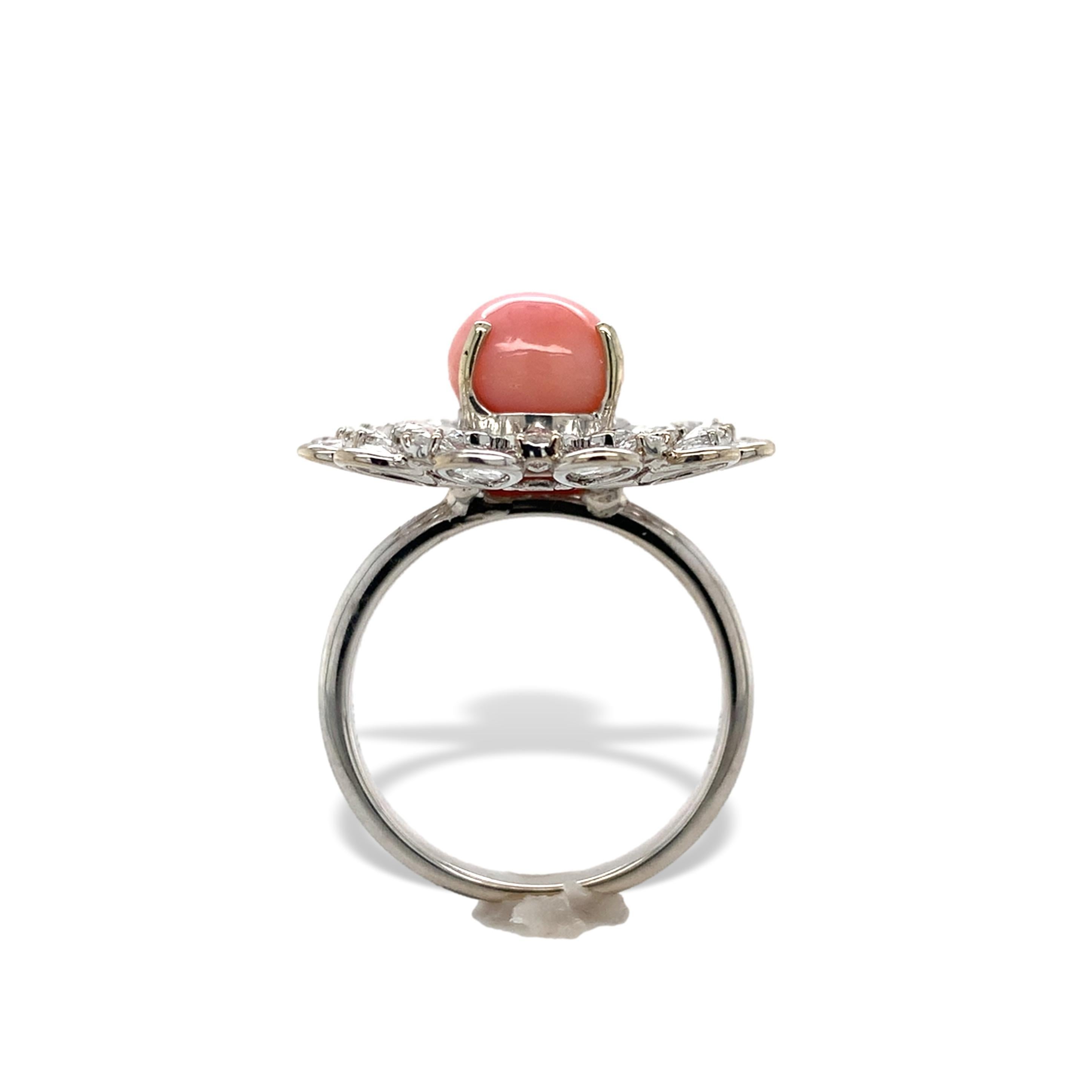 18K white gold ring featuring a natural conch pearl and 2 halos of rose cut diamonds. The conch pearl weighs 3.46 carats and is a beautiful pastel orange-pink color.  GIA report #1236446043 states natural and not treated. The pearl measures 8.51mm x