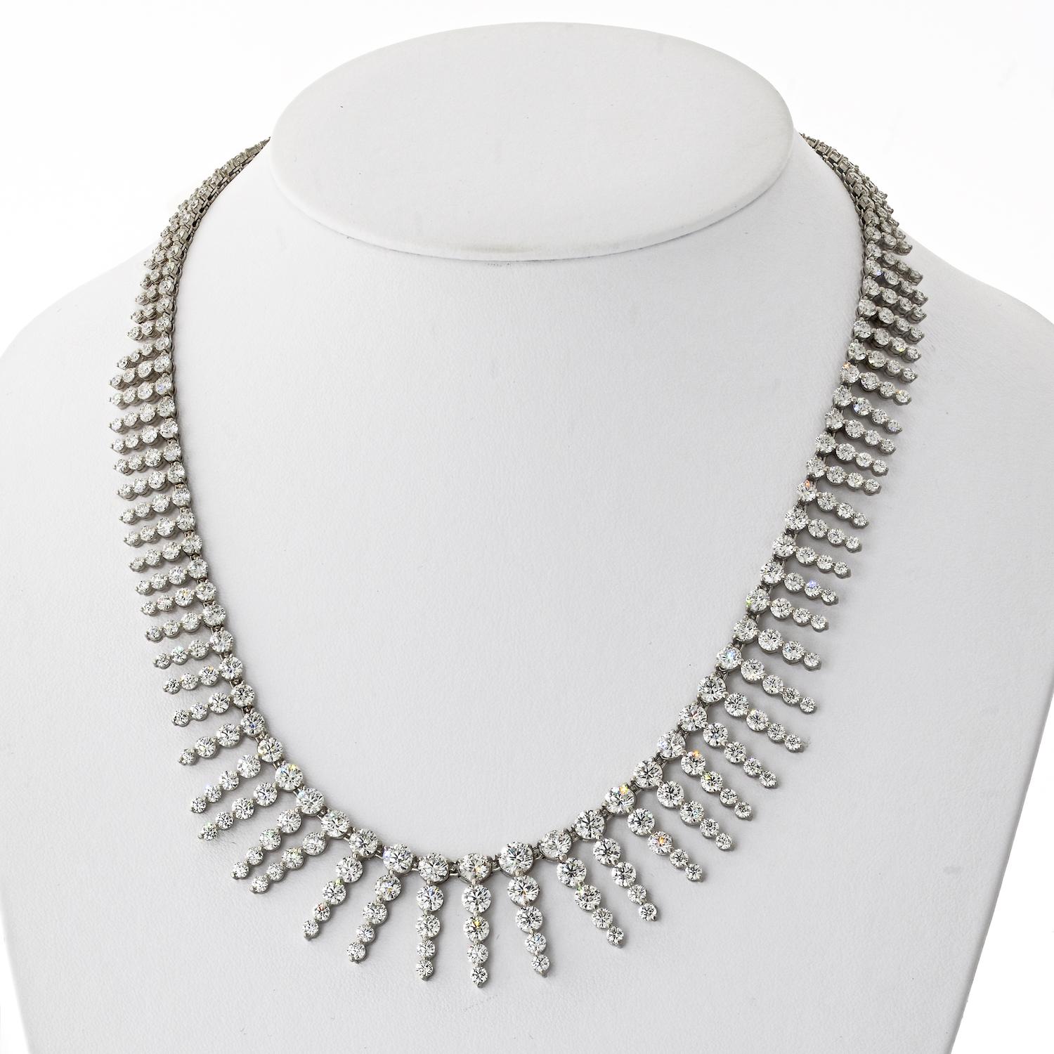 Drape yourself in the resplendent radiance of this Triple Dot Collar Diamond Necklace, a true embodiment of luxury and sophistication. Meticulously crafted in 18k white gold, this opulent piece boasts a stunning arrangement of 190 round diamonds,