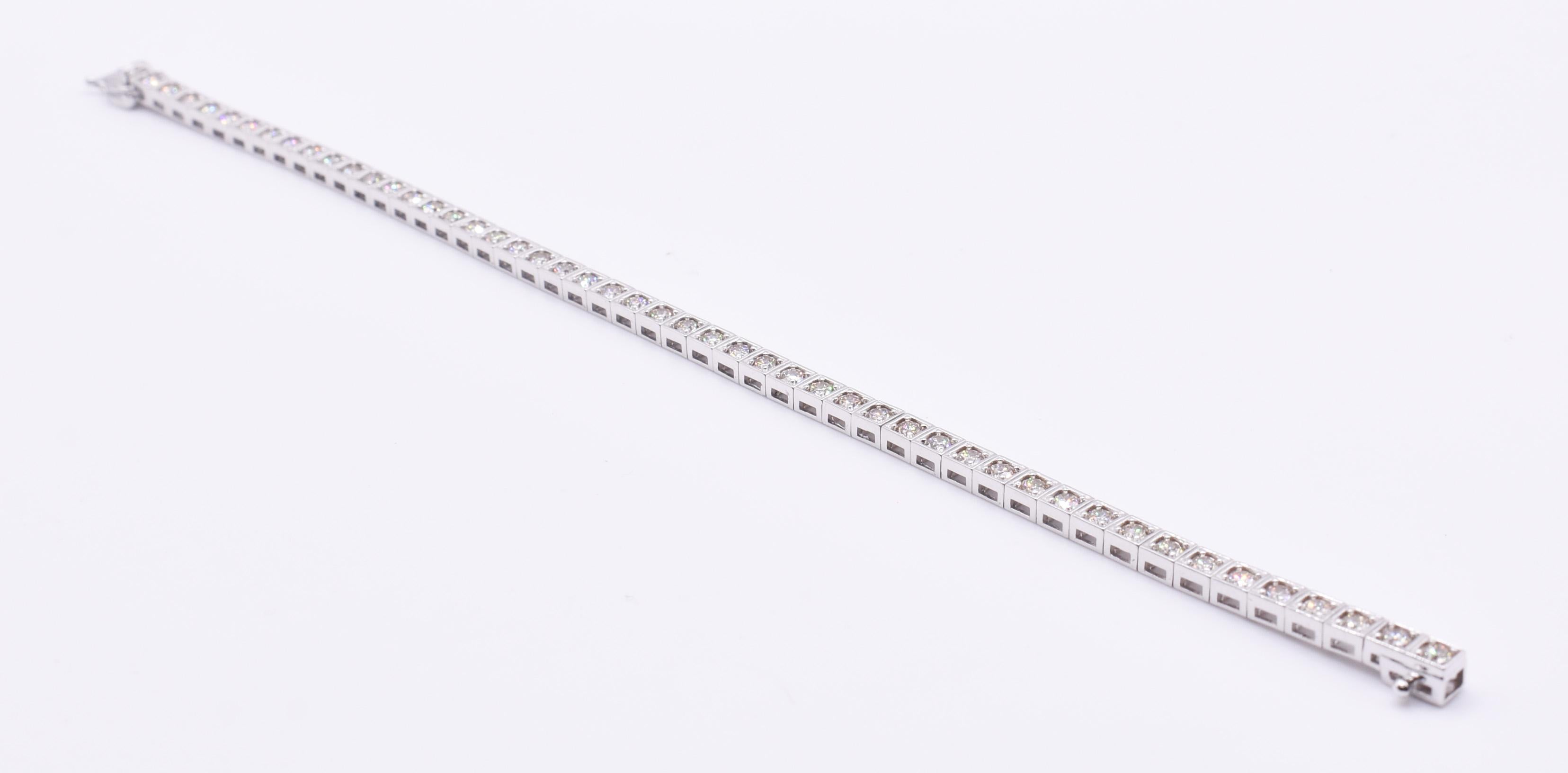 For sale is a fine quality 18k white gold 3.50ct tennisbracelet, featuring 49 round brilliant cut natural diamonds in a box setting. The diamonds rang from H-J in colour and are SI1 clarity.4750 The bracelet is equipped with a slide latch box