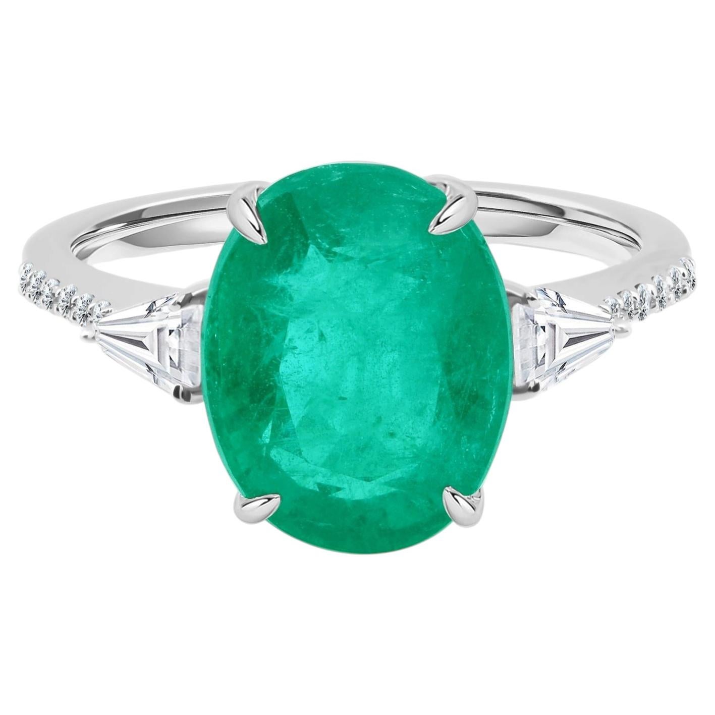 18K White Gold 3.74-Carat Oval Emerald and Diamond Three-Stone Ring