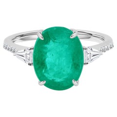 18K White Gold 3.74-Carat Oval Emerald and Diamond Three-Stone Ring