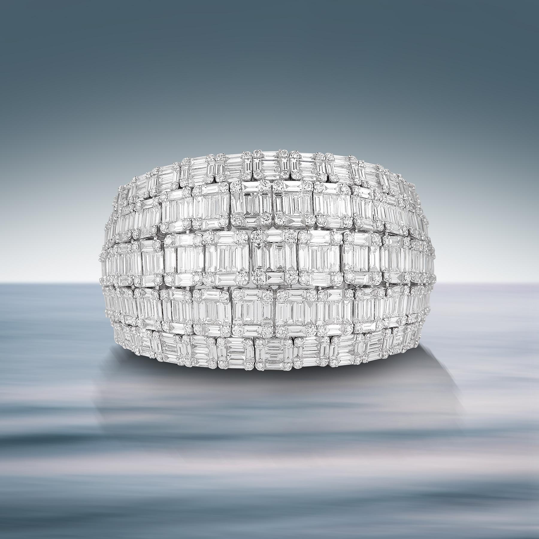 Breathtaking 18K White Gold Bangle Bracelet in a unique Cuff-Style with 5 Rows of 550 White Round Diamonds totaling 5.31 Carats & 662 Dazzling Baguette Diamonds totaling 33.01 Carats.