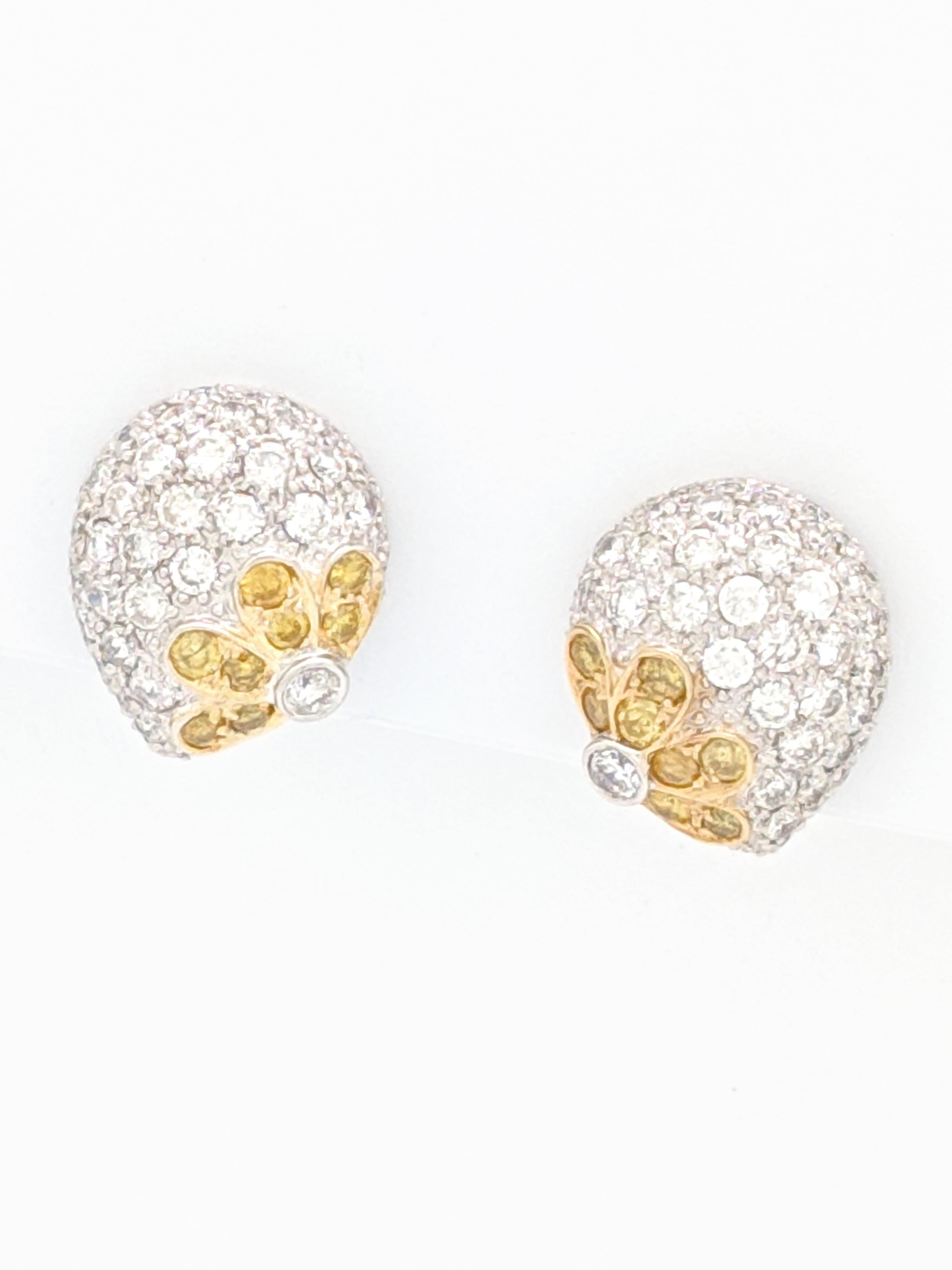 18K White Gold 3tcw Fancy Yellow & White Diamond Omega Back Earrings

You are viewing a gorgeous pair of fancy yellow and white diamond earrings.

These earrings are crafted from 18k white gold and weigh 10.5 grams. Each earring features natural