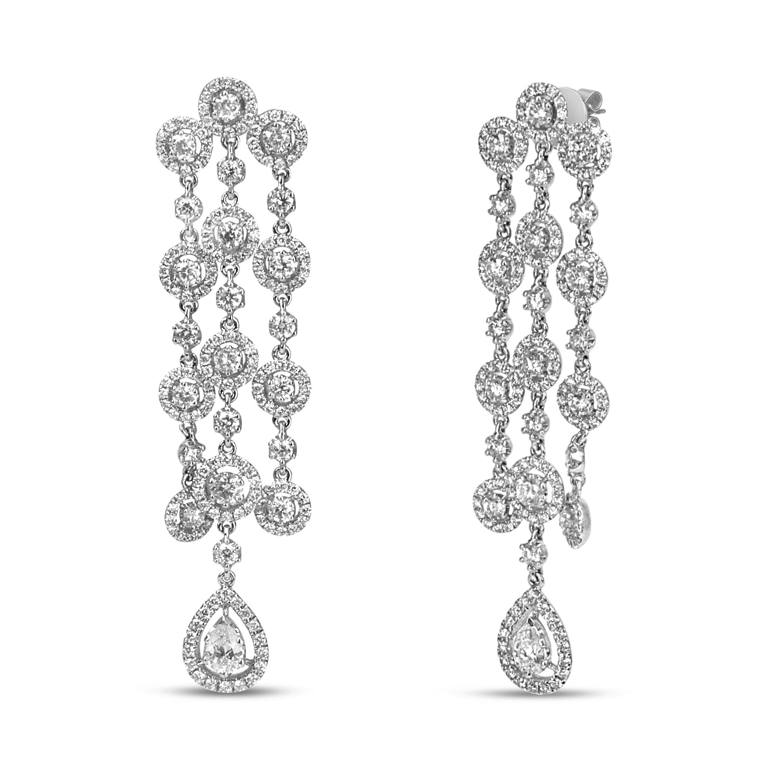 Light up the night in these ravishing waterfall diamond earrings that boast a beautiful, sparkling movement that will have heads turning the moment you walk into the room! A waterfall cascade of round and pear-shaped diamonds define the ethereal