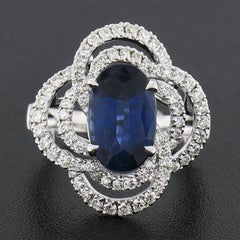 18K White Gold 4.15ct GIA Elongated Oval Sapphire W/ Diamond Infinity Swirl Ring