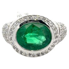 18K White Gold 4.19 Carat East-West Emerald Diamond Halo Cocktail Ring