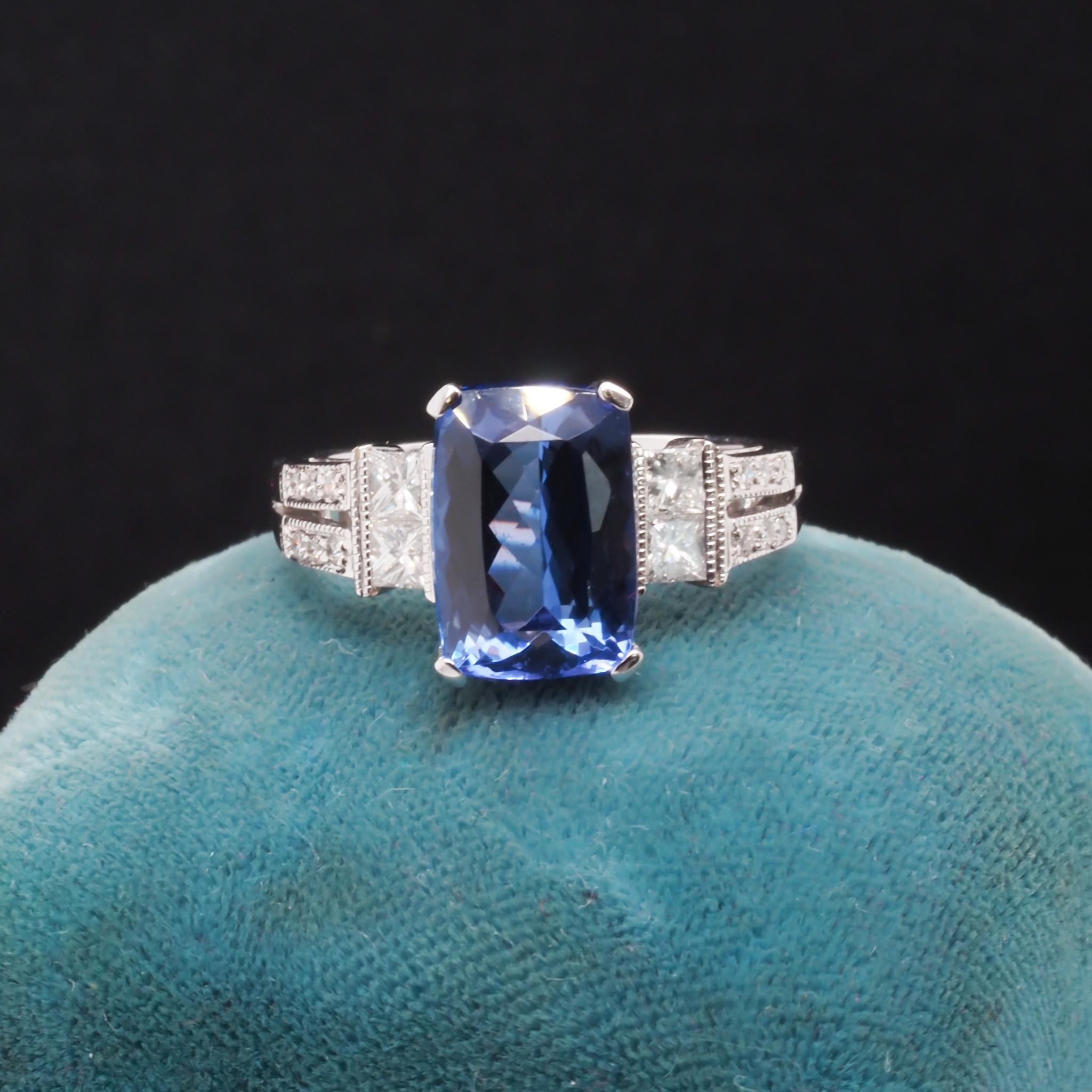 Year: 2000s
Item Details:
Ring Size: 7.25
Metal Type: 18K White Gold [Hallmarked, and Tested]
Weight: 6.2 grams
Tanzanite Details:
GIA Report #: 2225950711
Stone Weight: 4.37ct
Details: Cushion Shape, Violet-Blue, Natural Tanzanite
Diamond Details:
