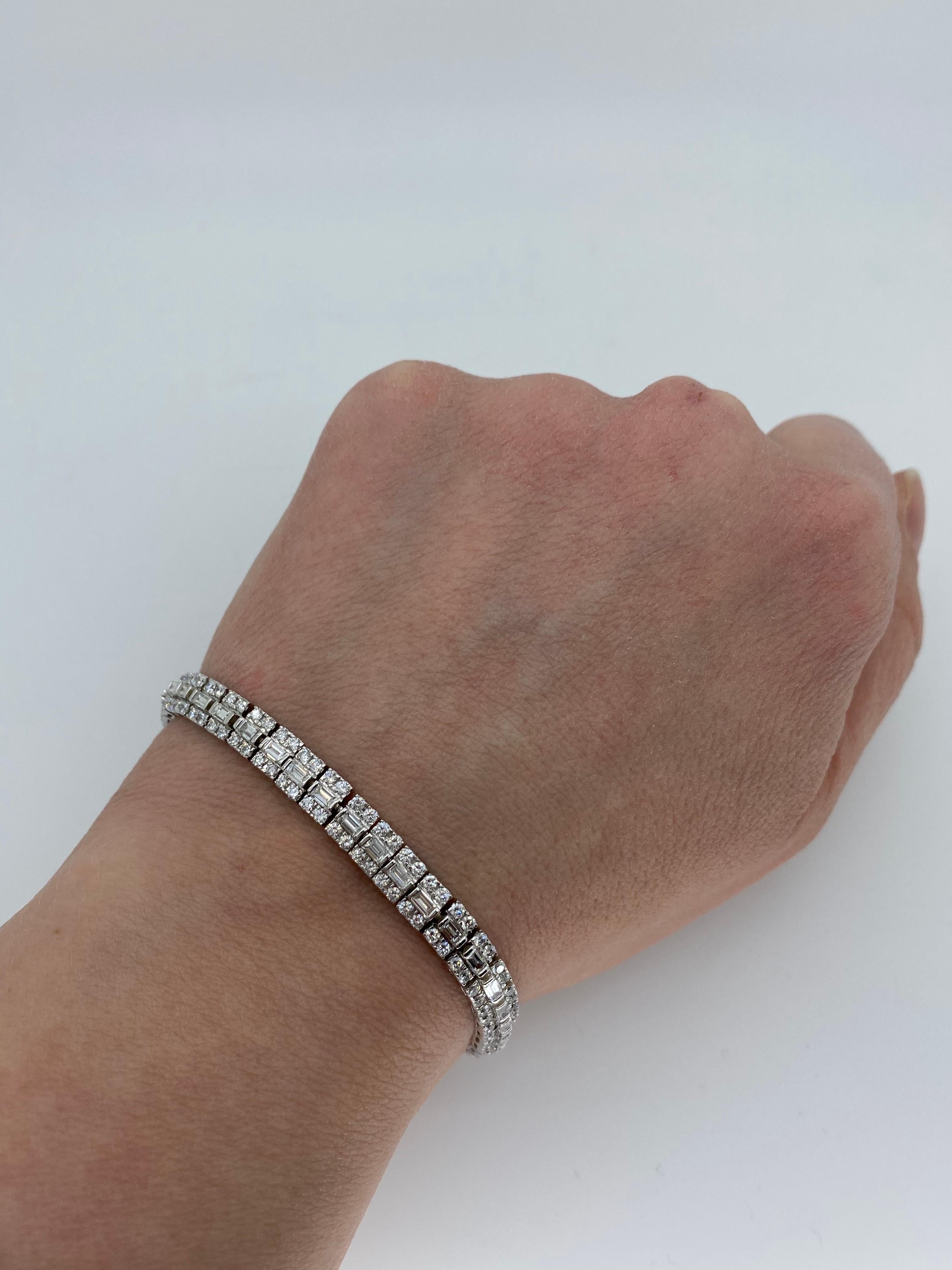 Approximately 4.60CTW baguette and round brilliant cut diamond tennis bracelet crafted in 18k white gold. 

Diamond Carat Weight: Approximately 4.60CTW
Diamond Cut: 172 Round Brilliant Cut Diamonds and 43 Baguette Cut Diamonds
Color: Average: