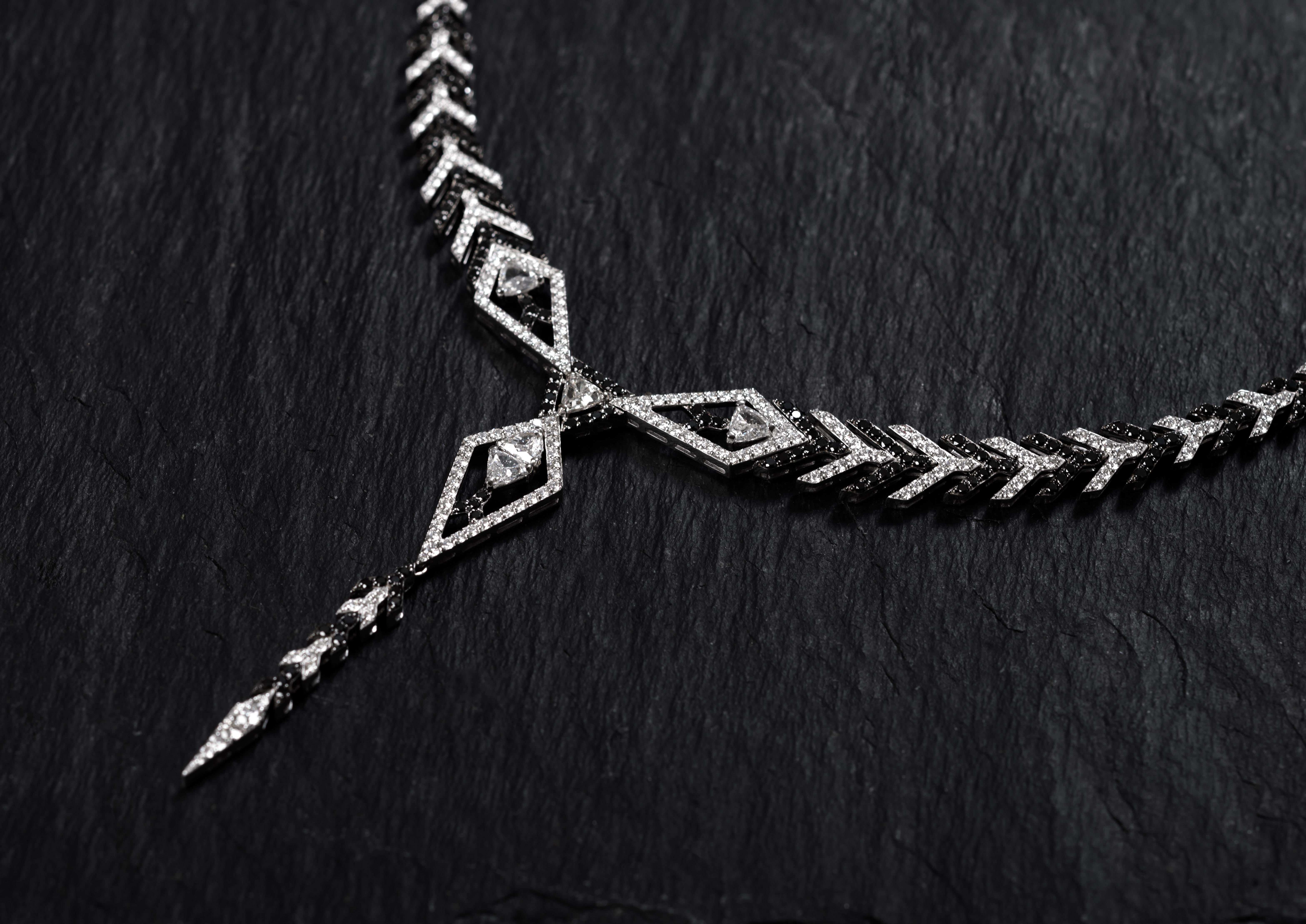 Embrace the show-stopping glamour with our extraordinary 18k white gold statement necklace. The piece is one of the highlights of the Amara collection, sparkling in a sophisticated colour pallet of black and white diamonds. The design presents arrow