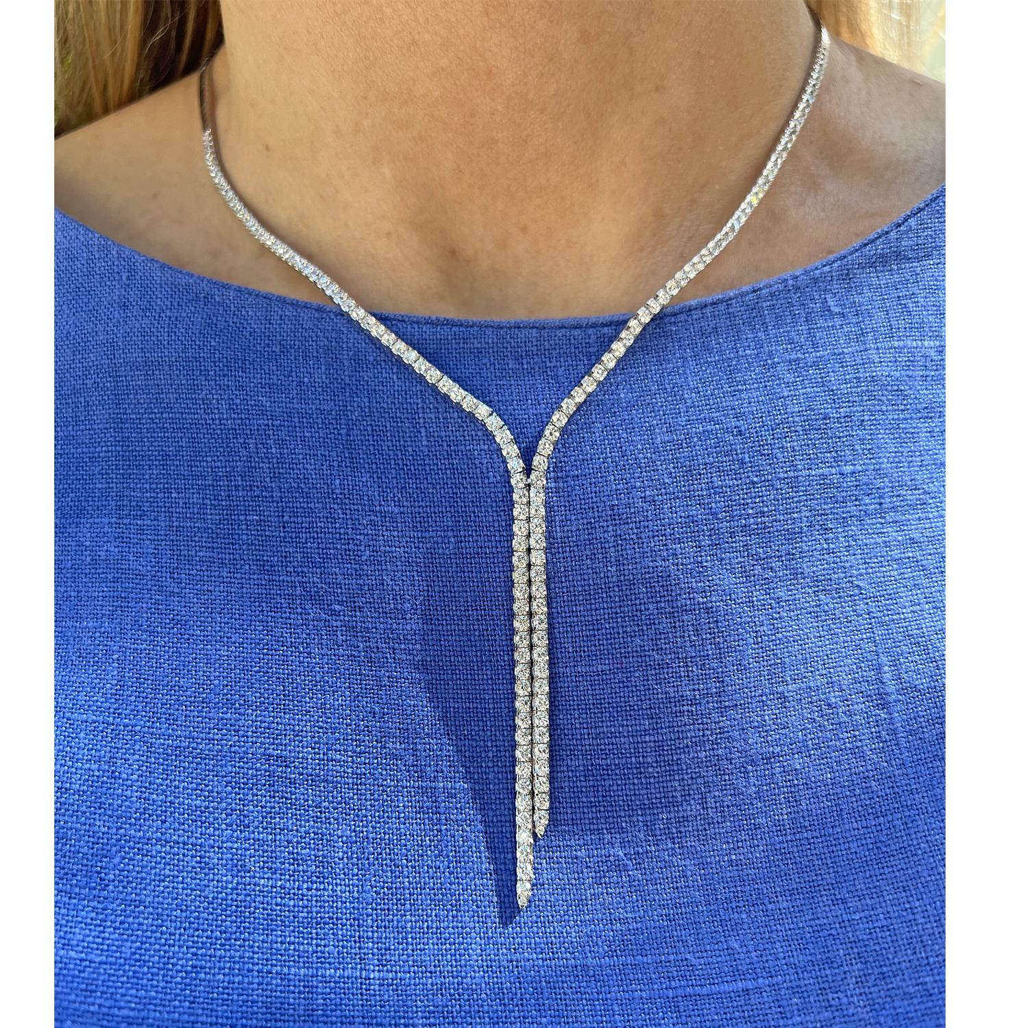 Diamond lariat necklace in polished 18k white gold, featuring 144 round brilliant-cut diamonds weighing 4.80 total carats.  Diamonds are G-H color and VS1-VS2 clarity.  Back half of the necklace is a polished flat link design.  Hidden clasp with