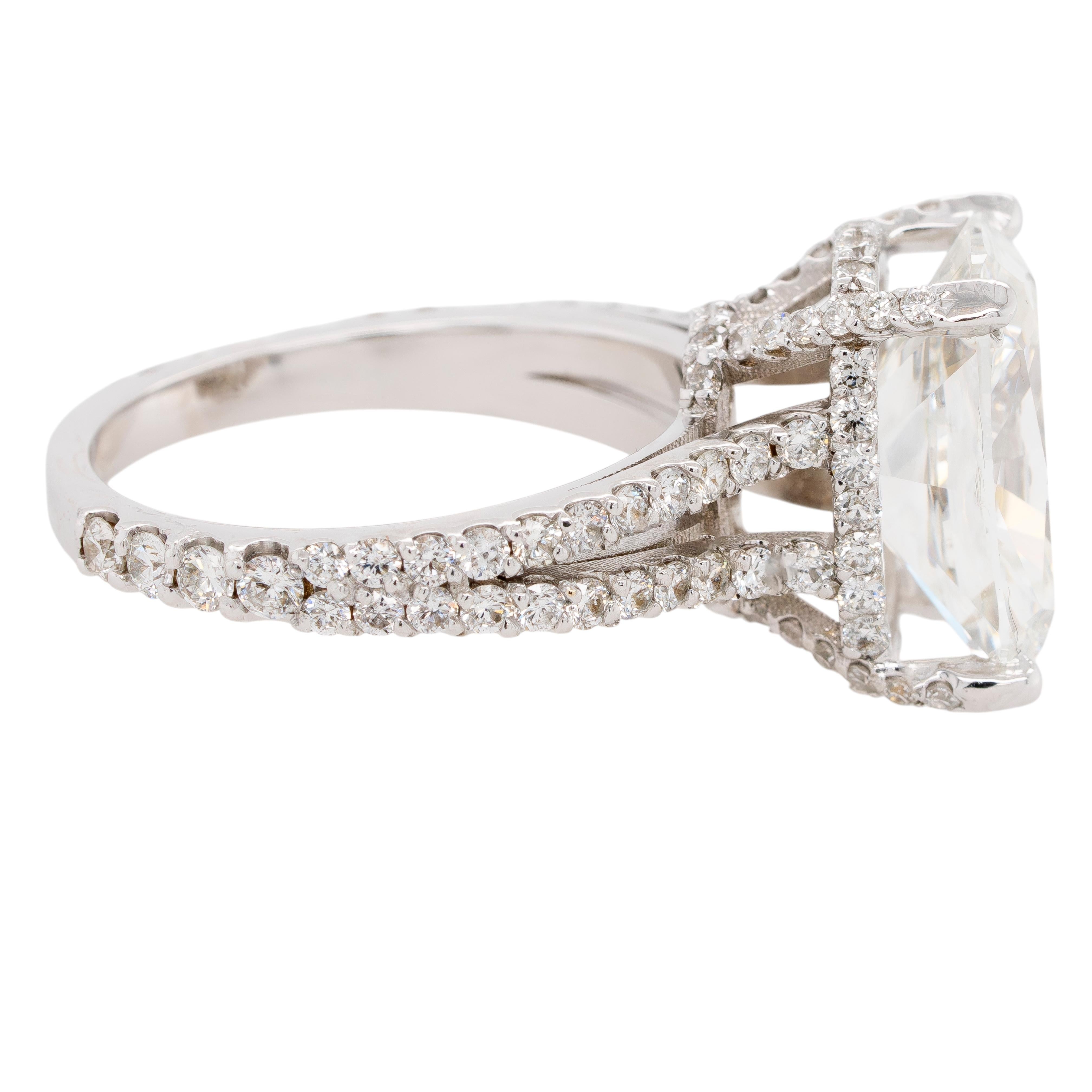 This extraordinary 18k white gold ring features a stunning 5.29-carat natural cushion-cut diamond, certified by GIA for its exceptional G color and SI1 clarity. The cushion cut combines soft edges with brilliant facets, showcasing remarkable fire