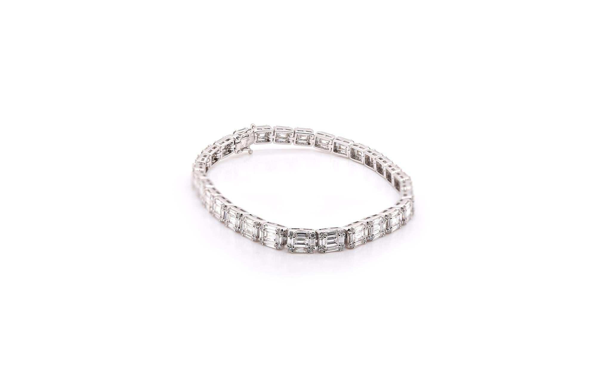 Designer: Custom Designed
Material: 18k white gold
Round Diamonds: 120 round brilliant cuts = .68cttw
Color: G
Clarity: VS
Baguette Diamonds: 150 baguette cuts = 4.92cttw
Color: G
Clarity: VS
Dimensions: the bracelet measures 7 inches in length and