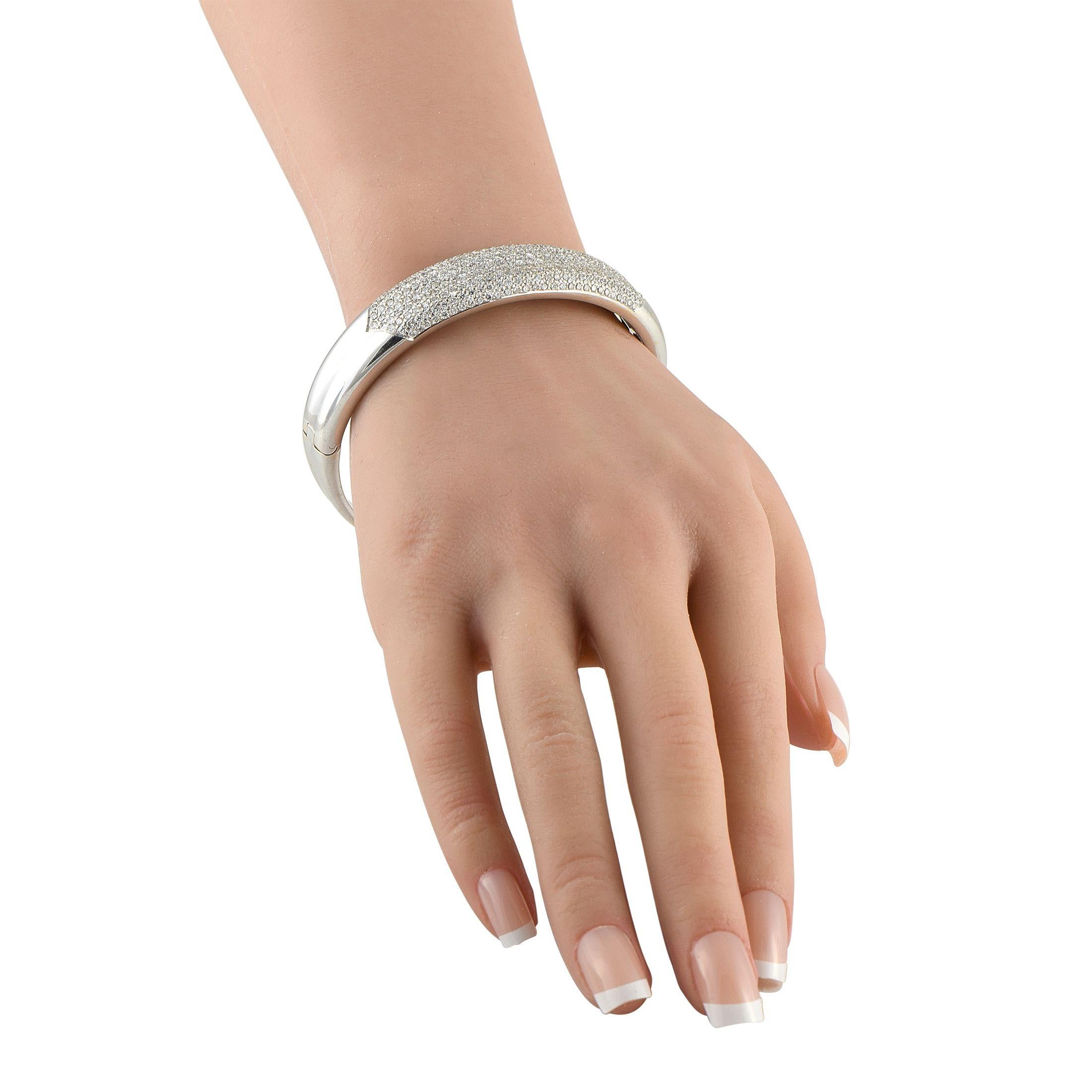 Perfect for every occasion, this diamond bangle shines with 5.82 carats of pav diamonds. Its sleek white gold construction keeps it versatile for the day, while the brilliant sparkle makes it dazzling at night. Worn solo or stacked, it's bound to