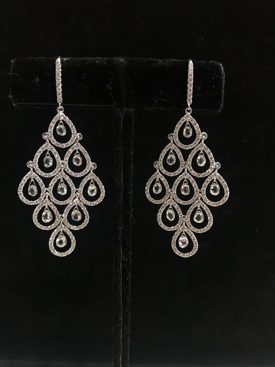 PANIM Cocktail Diamond Dangling Earrings 18 Karat White Gold, 6.23cts

Diamond drop earrings in cut down style settings, with 12 briolette cut diamonds and small round brilliant cut diamonds. Each drop shape diamond weighing approximately 0.25