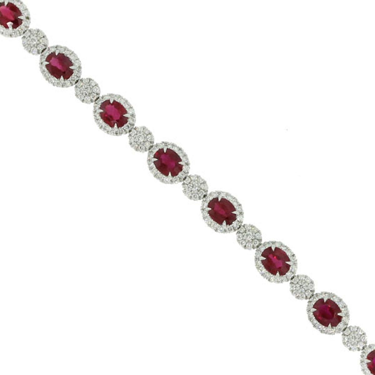 Material-18k White Gold
Gemstone Details-Approx. 6.25ct Oval Cut Ruby Gemstones.
Diamond Details-Approx. 2.04ct Round cut diamonds. Diamonds are G/H in color and SI in clarity
Measurements-7