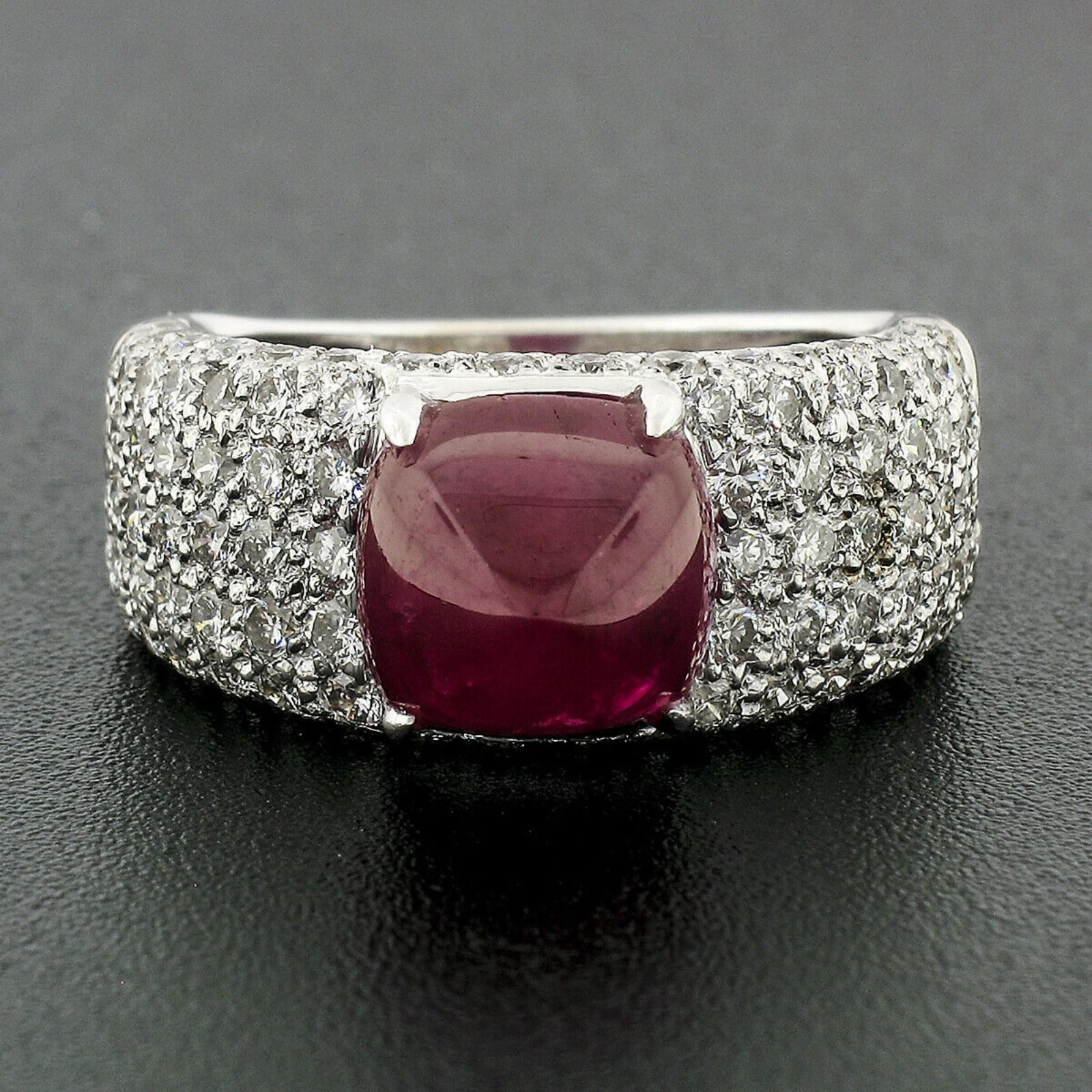 This gorgeous band ring was crafted from solid 18k white gold and features a cushion sugarloaf cut ruby with a magnificently rich wine-red color. The stone weighs exactly 4.97 carats and is certified by AGL as being a naturally mined stone