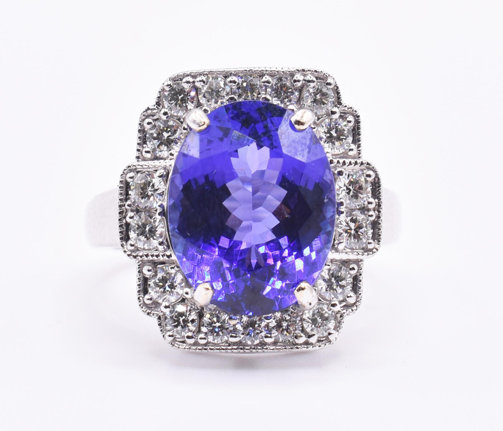 A superb 18k white gold tanzanite ring, featuring a 6.62 carat tanzanite to the centre, in a prong setting, surrounded by 18 round brilliant cut diamonds, also prong set. 

Metal: 18k White Gold
Total Carat Weight (Tanzanite): 6.62ct
Total Carat