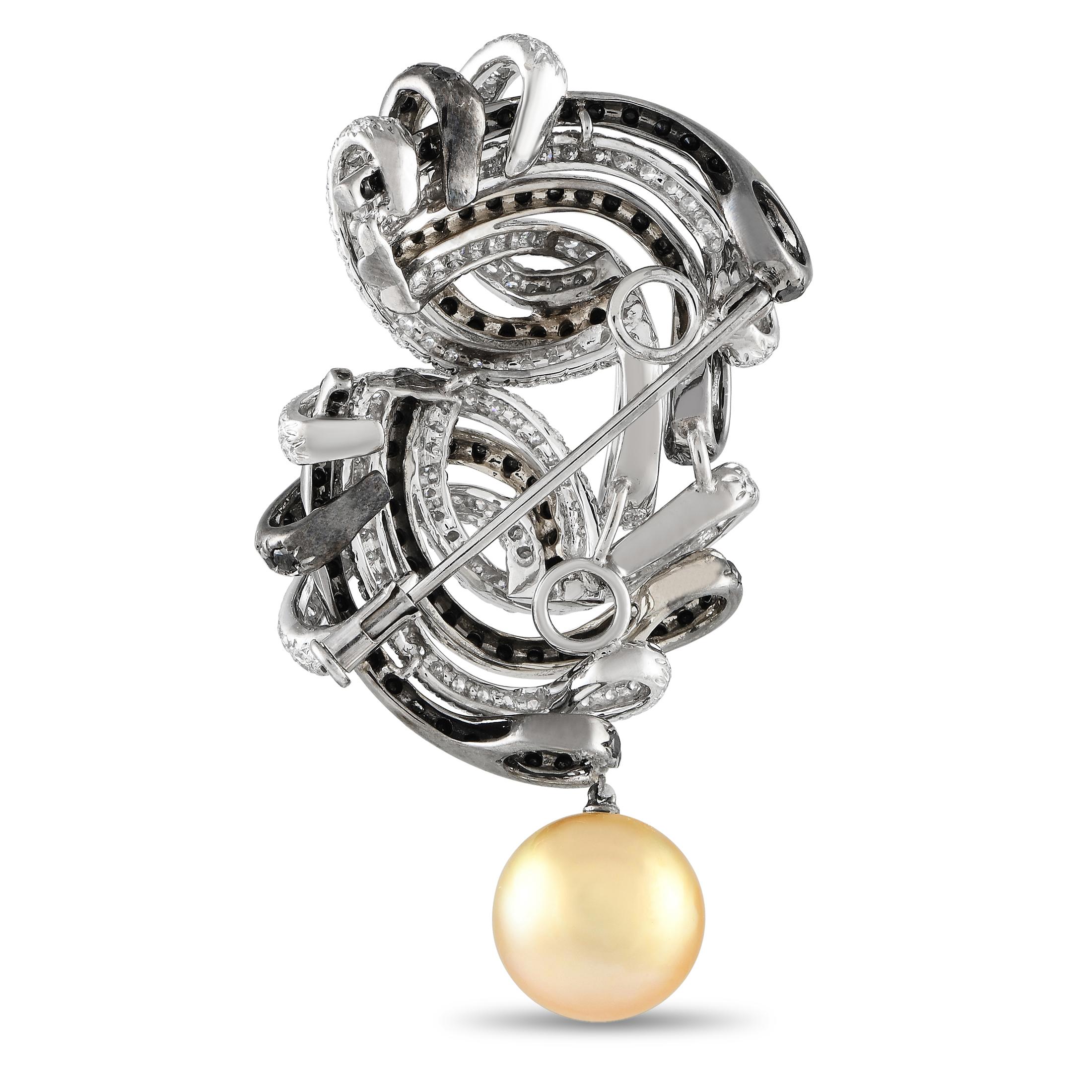 A combination of White Diamonds totaling 2.75 carats and Black Diamonds totaling 4.0 carats create an elegant contrast on this dramatic 18K White Gold brooch. At the bottom of the design, a singular 12mm Golden Pearl provides the perfect finishing