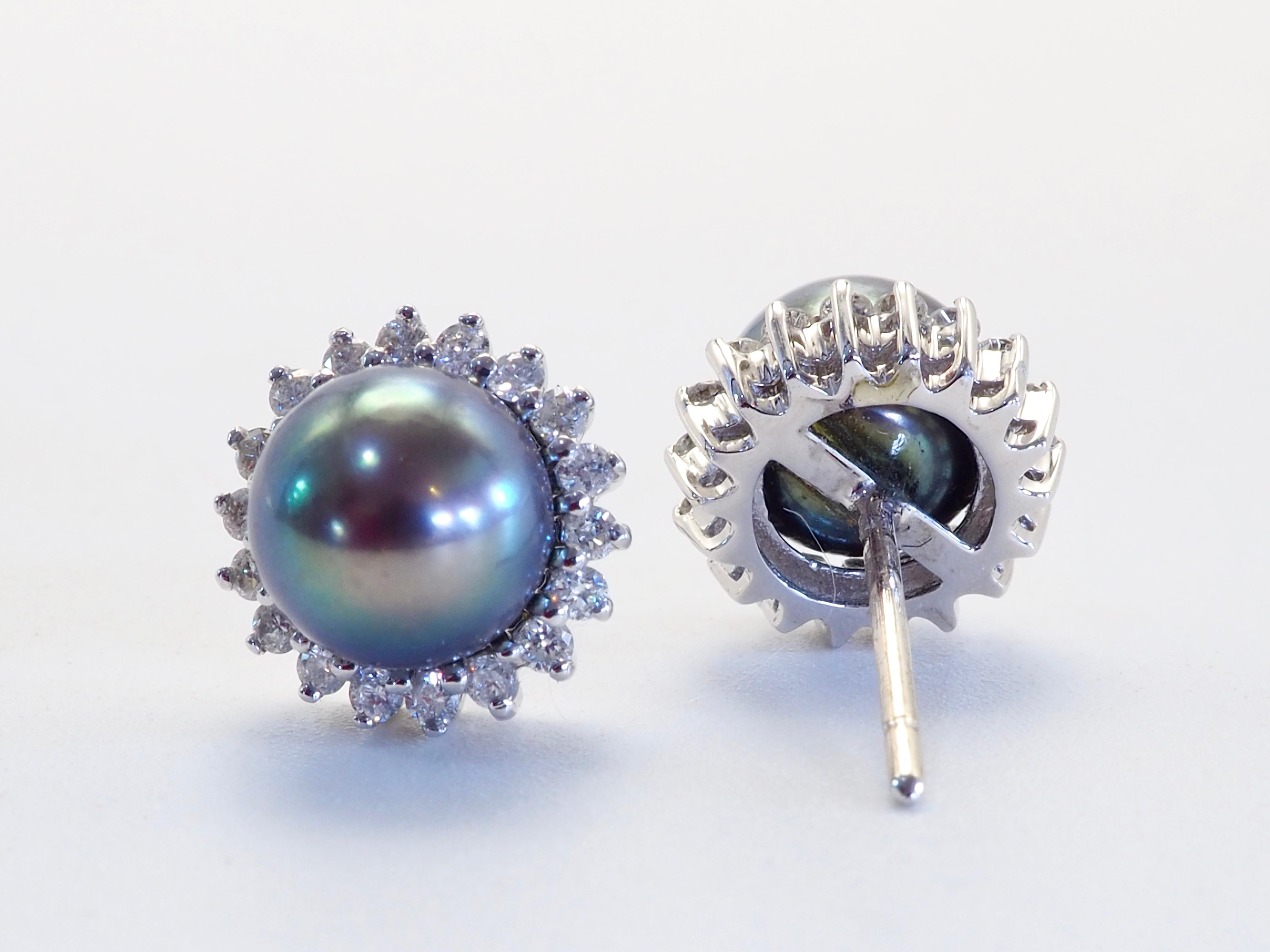 Presented here is a fine and gorgeous round and almost eye clean without blemishes with matching color which are of the famous Tahiti pearls. The greenish tint pearls are surrounded by brilliant diamonds. The brilliant round diamonds are genuine
