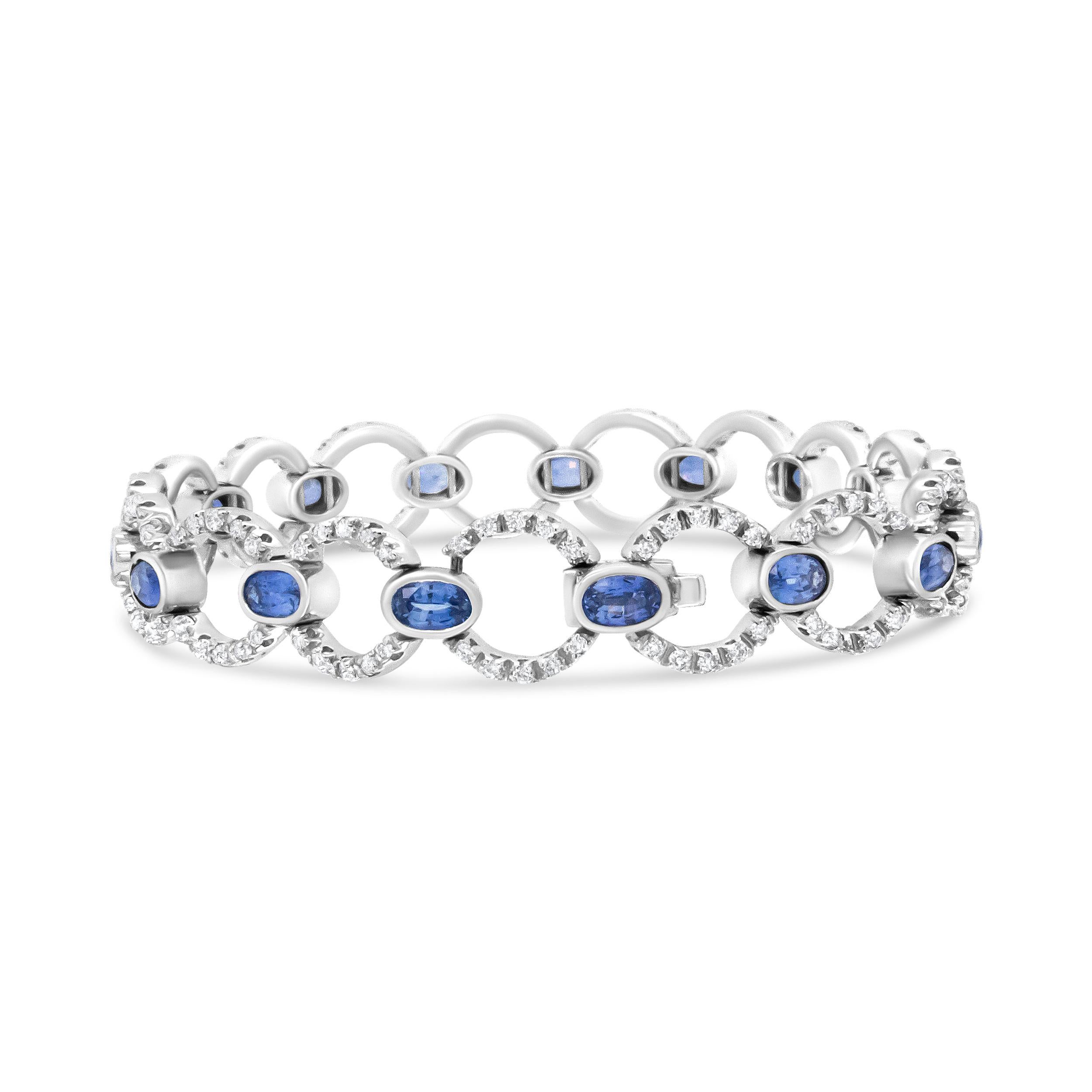 This luxury 18k white gold link bracelet showcases a shimmering circle links set with glorious round white diamonds in prong settings. These sparkling stones total 6 cttw with an approximate F-G Color and SI1-SI2 Clarity. Each circle link is