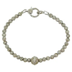 Bracciale tennis in oro bianco 18 carati con diamanti da 6 carati e sfera centrale incrostata di diamanti