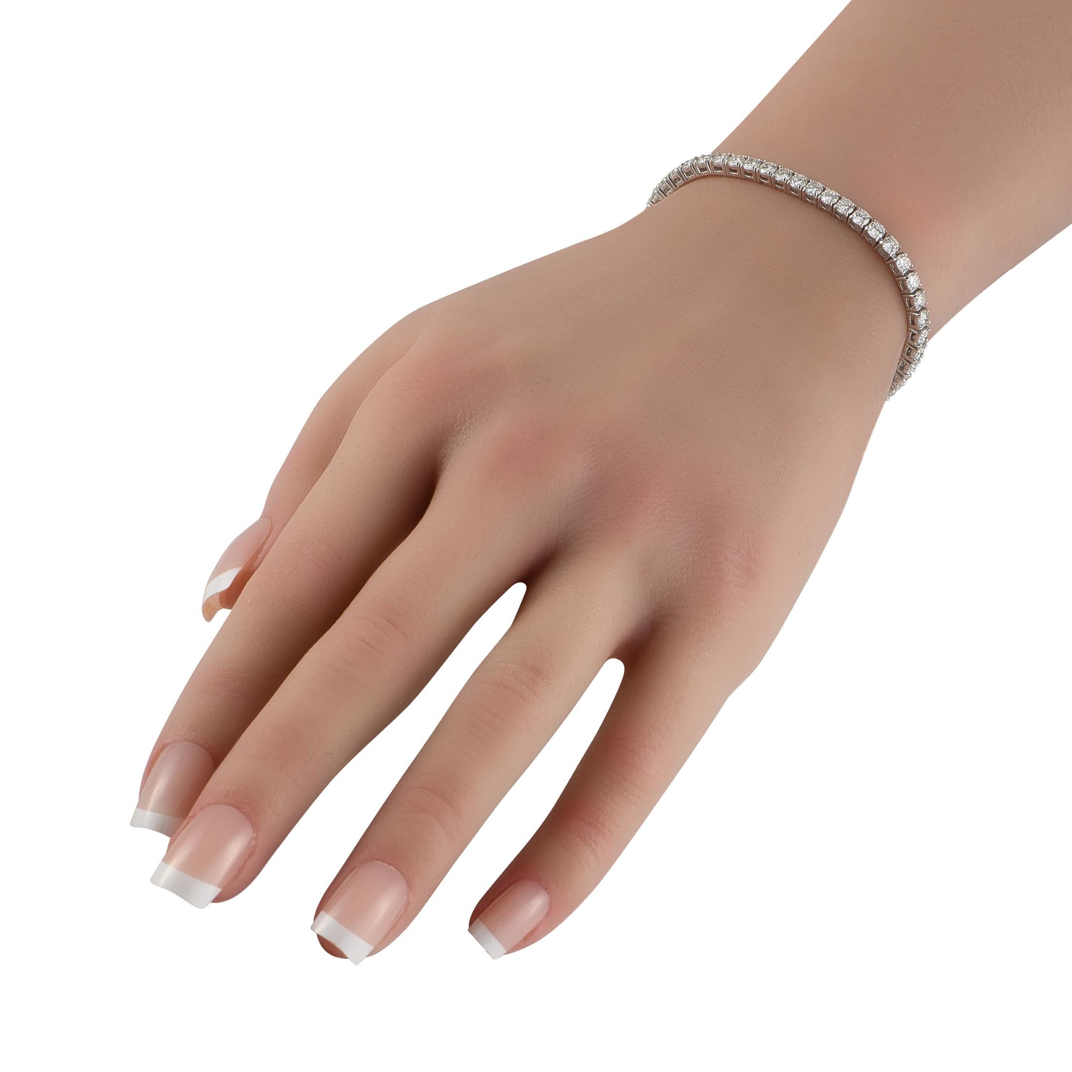 This classic tennis bracelet the perfect way to add a touch of luxury to any occasion. Stylish and incredibly impressive, this timeless design is crafted from 18K White Gold and includes a series of round-cut Diamonds totaling 7.09 carats. It