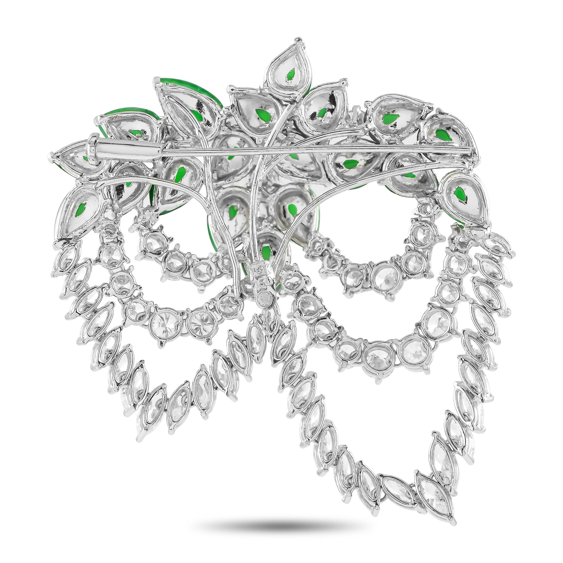 Let the beauty of this vintage piece remind you not to lose touch with nature. This Art Nouveau brooch in white gold is detailed with 7.5 carats of diamonds and approximately 10.0 ct jade gemstones. The radiant, pear-shaped green gems are assembled