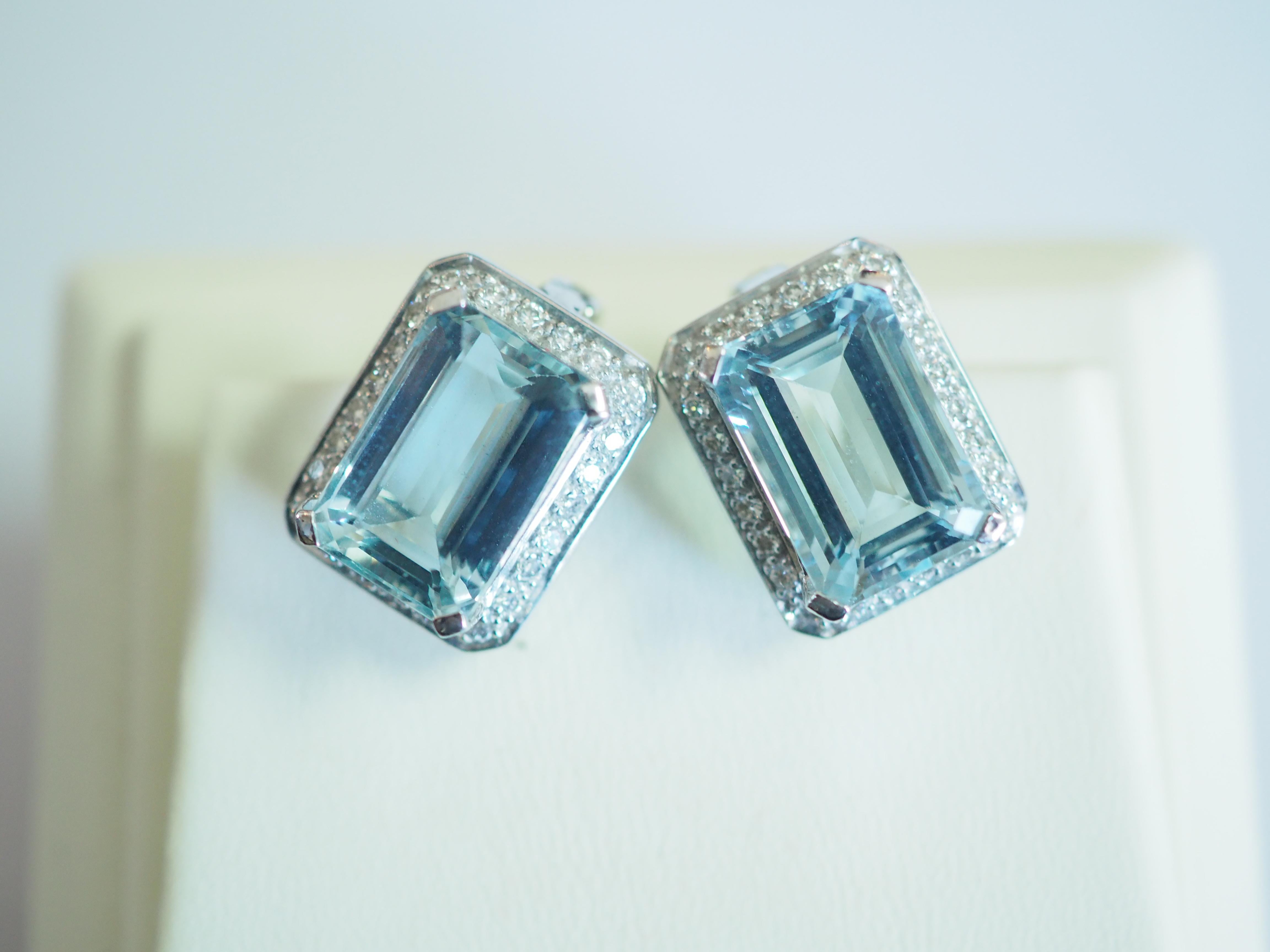 Beautiful latch back earrings made in the early 2000's and has never been worn. There are 2 good quality and decent sizes of emerald cut aquamarines. The aquamarines are all set in prong and with immaculate craftsmanship. The brilliant melee