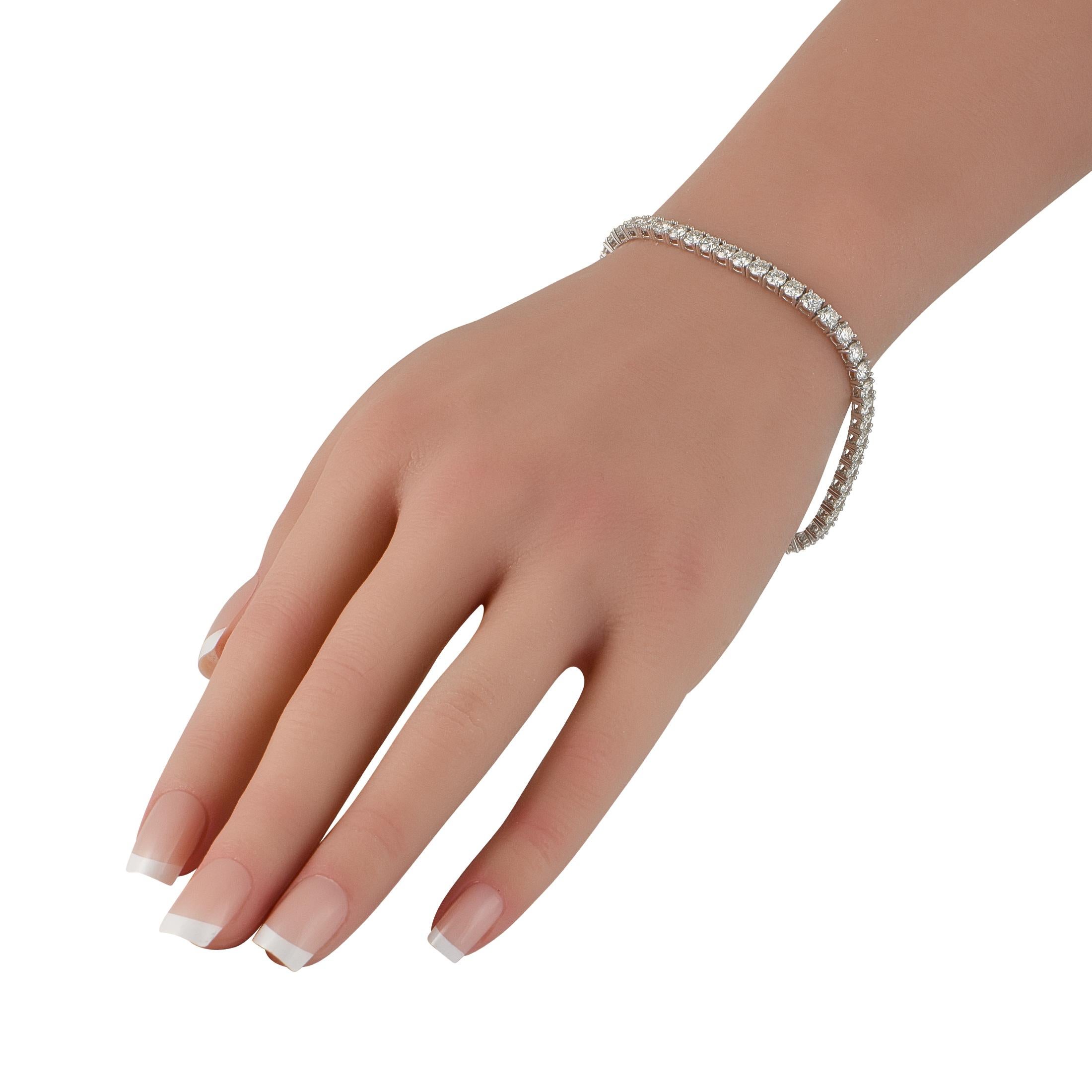 This tennis bracelet exudes classic elegance. Diamonds with a total weight of 8.61 carats make it the perfect way to add a touch of luxury to absolutely any ensemble. It features a 18K White Gold setting and measures 7.5 long.This jewelry piece is