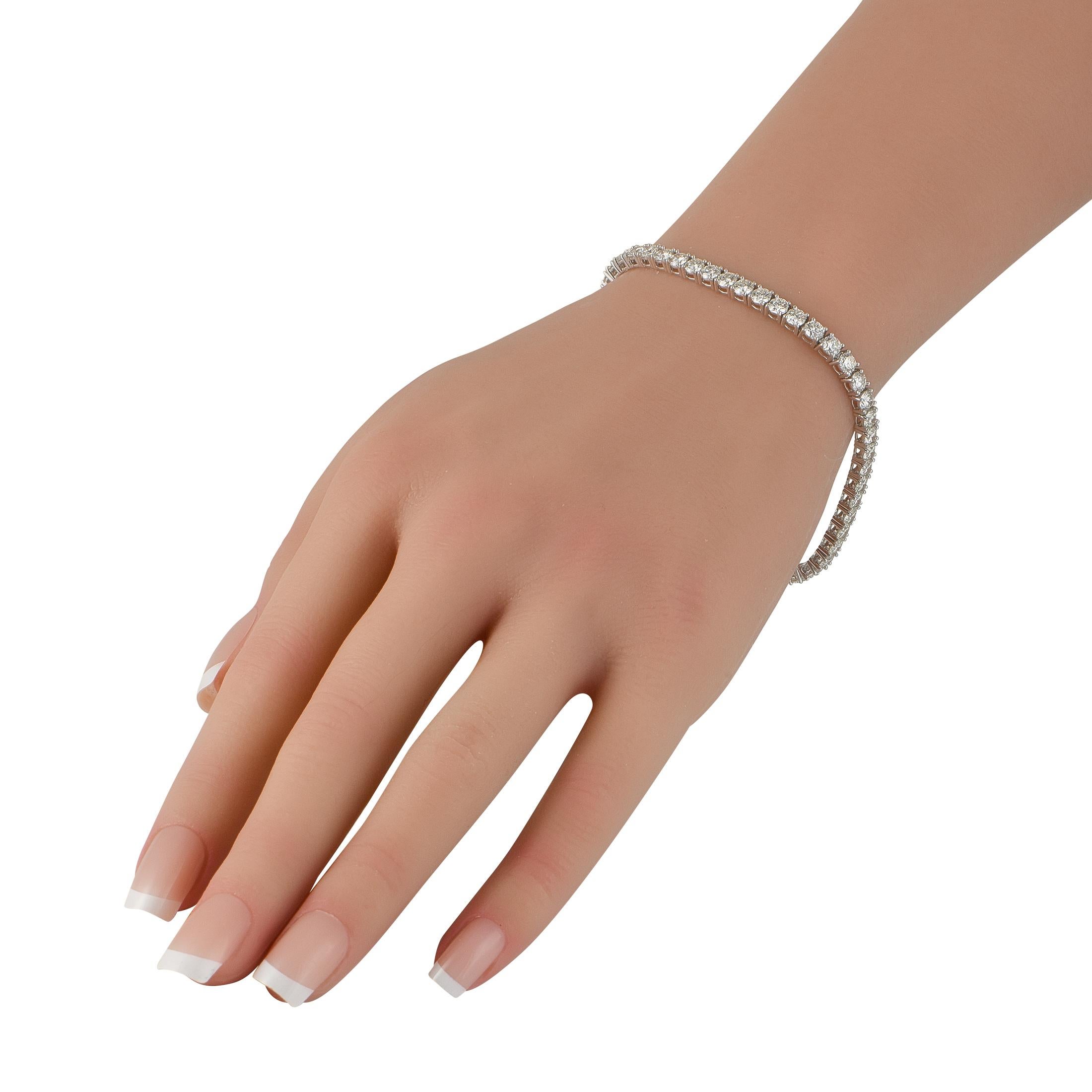 A series of sparkling Diamonds totaling 8.76 carats make this classic tennis bracelet endlessly impressive. Crafted with an 18K White Gold setting, it measures 7.5 long and includes secure tab insert clasp closure.This jewelry piece is offered in