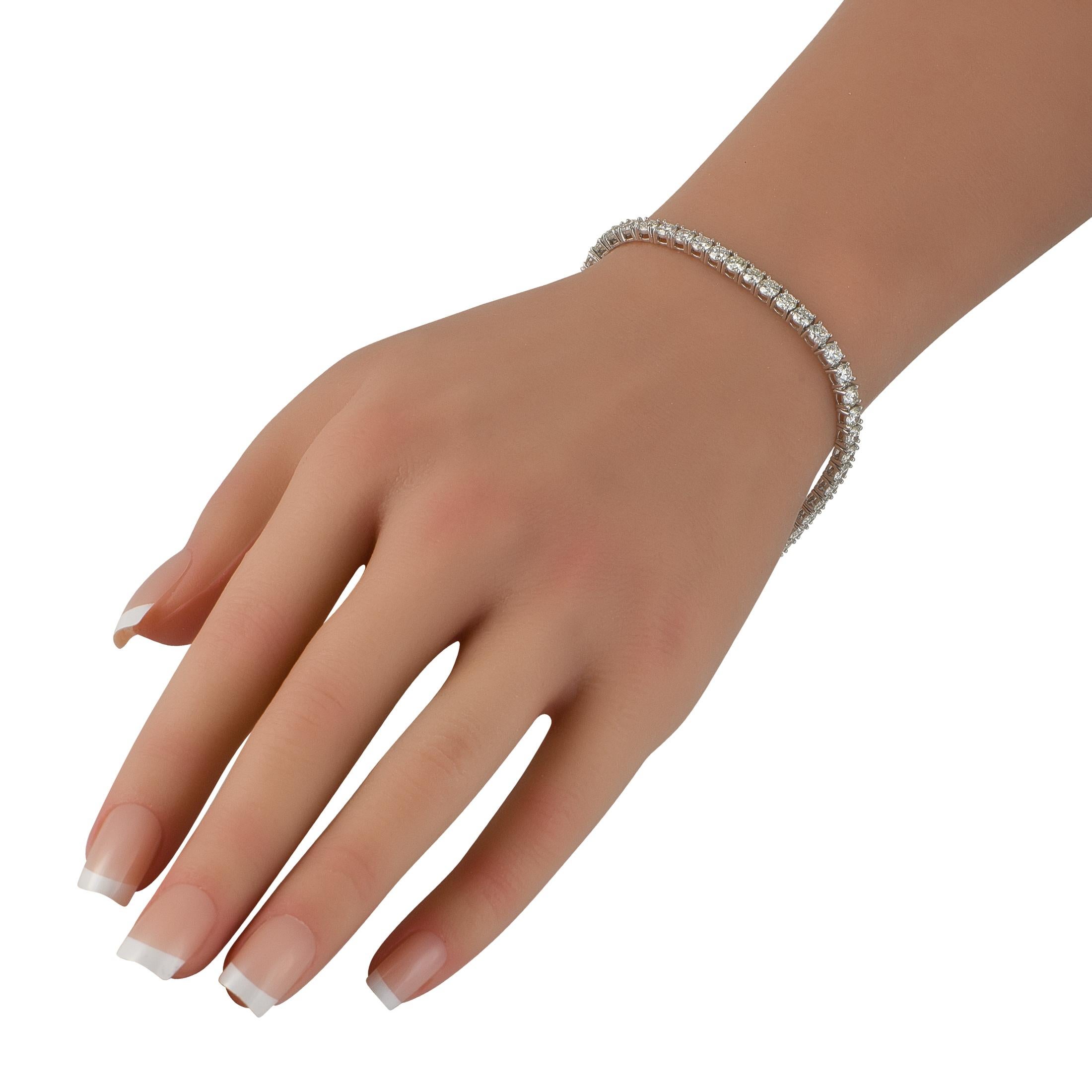 Add a touch of sparkle to any ensemble with this classic tennis bracelet. Set in 18K White Gold, Diamonds with a total weight of 9.03 carats allow it to make a subtle statement. It measures 7.5 long and includes tab insert clasp closure.This jewelry