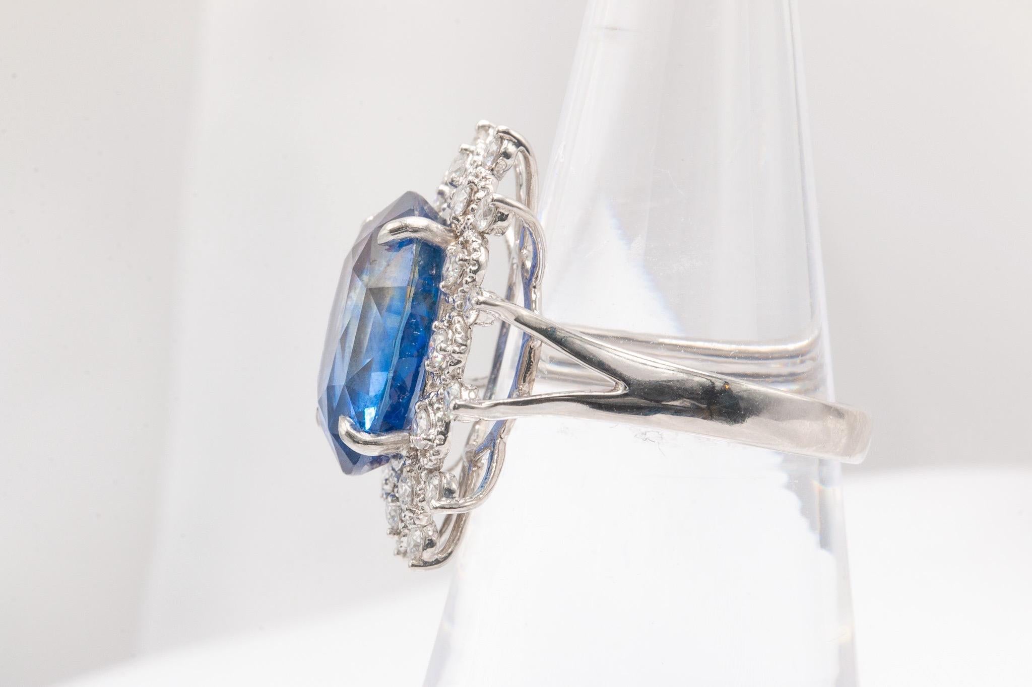 This beautiful halo ring has a vintage look and a luxurious feel. It’s perfect for wearing as a cocktail ring or an engagement ring. The center stone is a stunning 9.27-carat oval sapphire, certified by GIA as being from Sri Lanka. Made from 18k