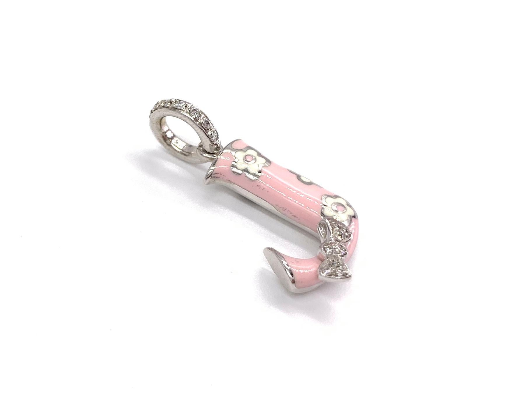 A hand made 18k white gold Aaron Basha letter J charm or pendant featuring .08 carats of round brilliant white diamonds (approximately G color, VS2 clarity) on the bale & on the adorable bow accent. Light blush pink & white enamel are hand