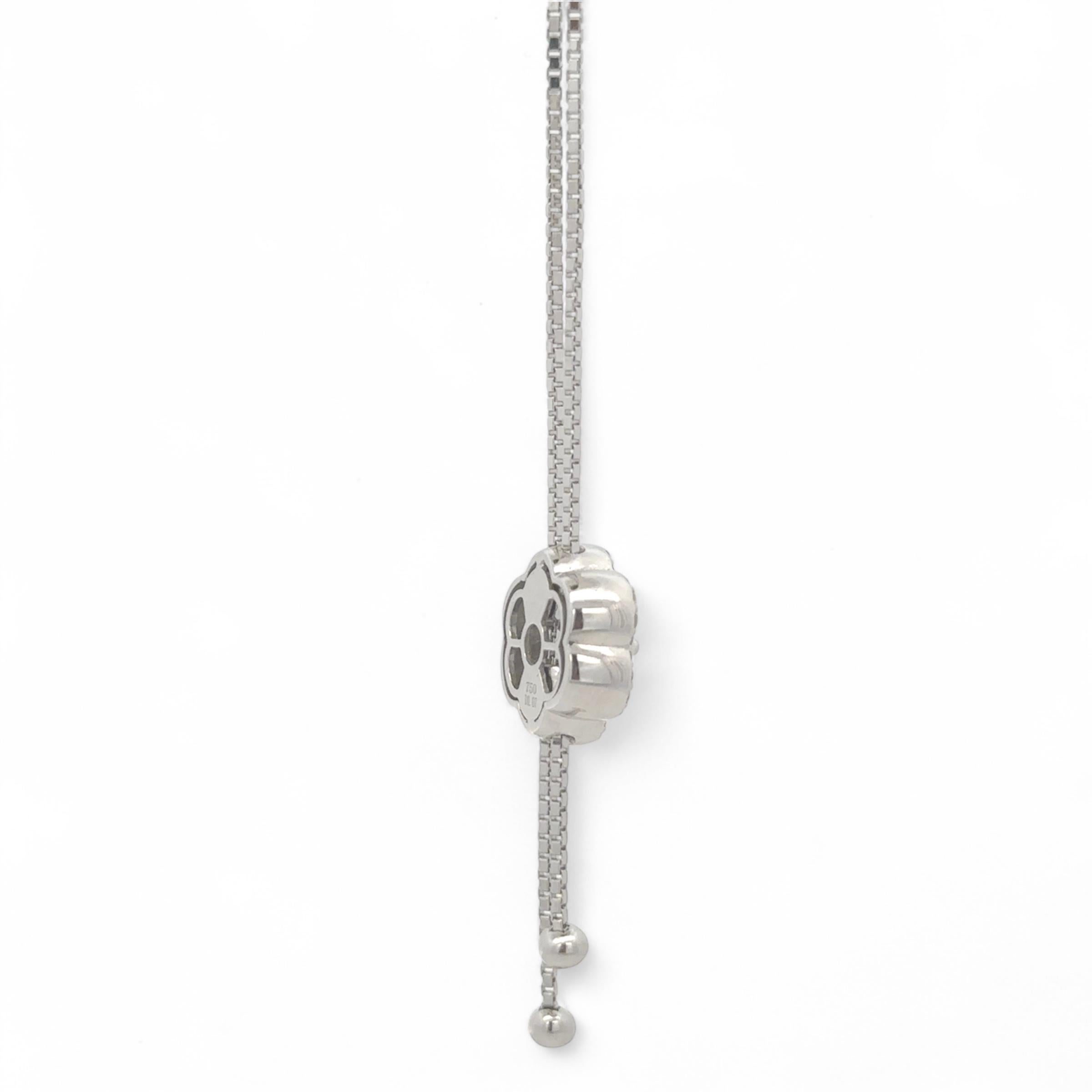 Discover the enchanting allure of the 18k White Gold Necklace with an Adjustable Flower Pendant. This exquisite piece is thoughtfully designed with a delicately crafted flower, its petals artfully encrusted with pavé-set diamonds that sparkle with