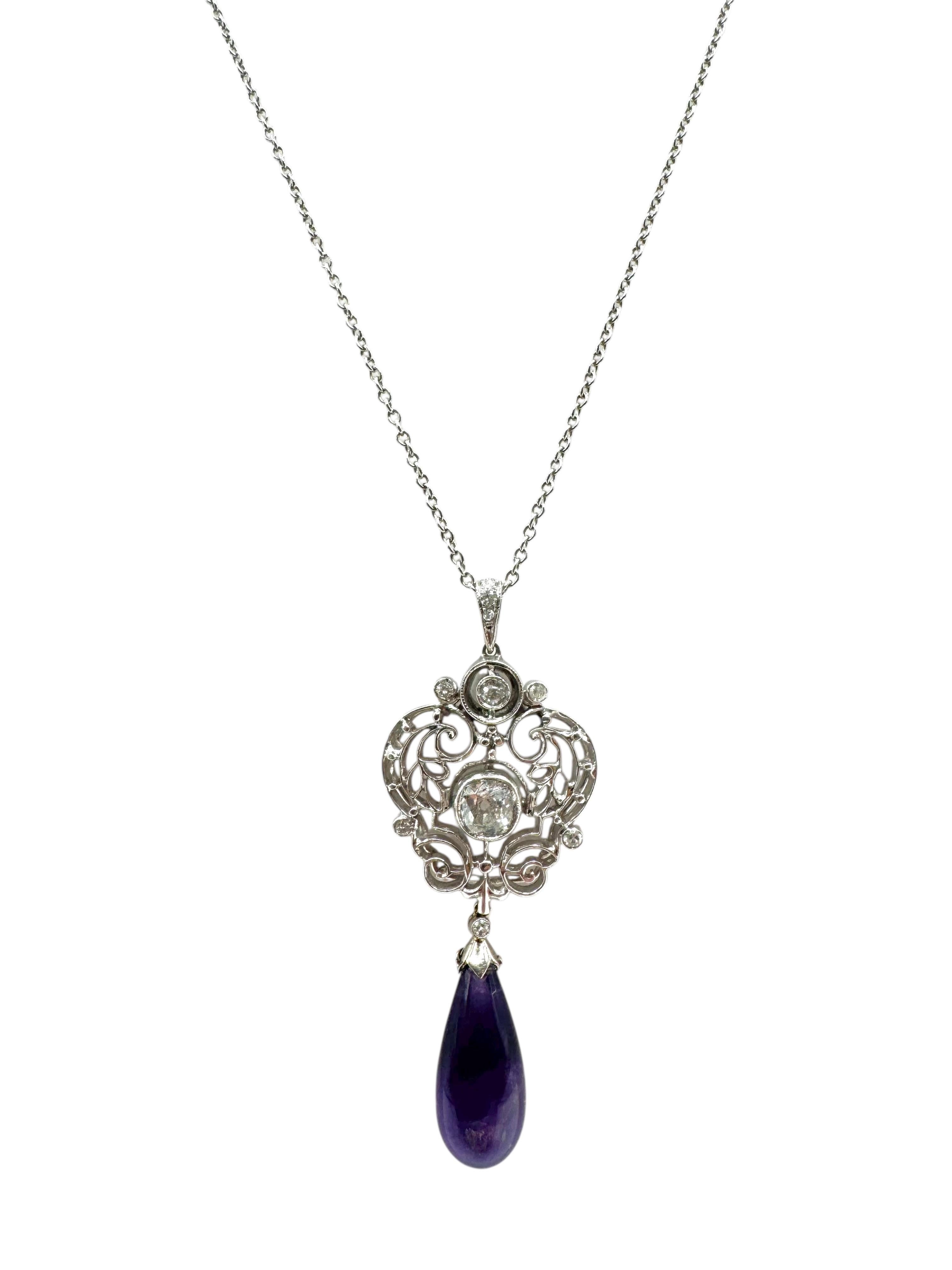 A striking modern interpretation of vintage elegance, this 18K white gold pendant necklace features a richly colored amethyst teardrop suspended from an ornate scrollwork medallion set with brilliant-cut diamonds. The openwork design adds lightness