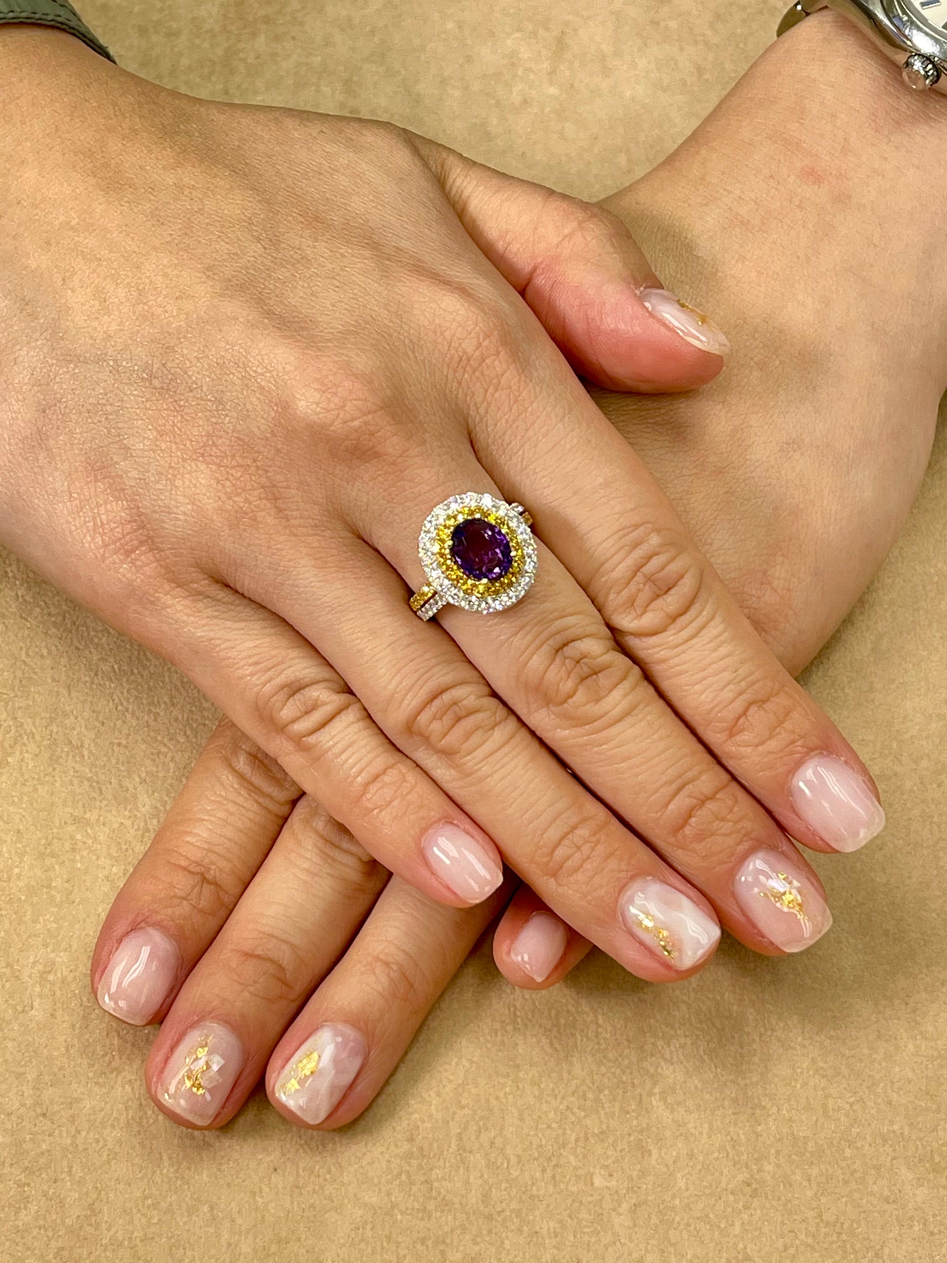 Here is a unique ring made with very colorful stone combinations. This cocktail ring is set in 18k white and yellow gold, a top quality Amethyst, fancy vivid yellow and white diamonds. The center Amethystis (2.34 Cts) is of top quality with