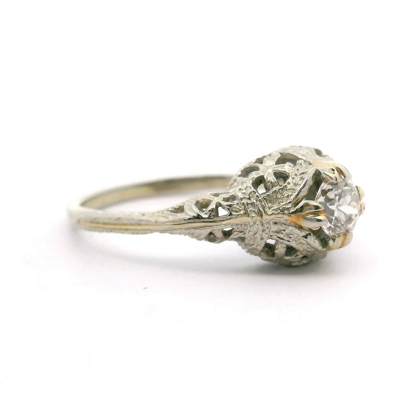 Condition:  Very Good
Metal:  18k Gold (Marked, and Professionally Tested)
Weight:  2.3g
Diamond:  Round Cut Natural Diamond 0.33ct
Diamond Color and Clarity:  I and SI1
Width:  12mm at face, 1.5mm at back
Markings:  