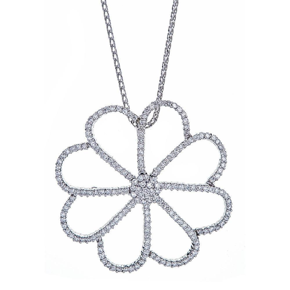 This exquisite flower pendant is handcrafted in 18K white gold with diamonds, and comes with a 14K white gold chain.