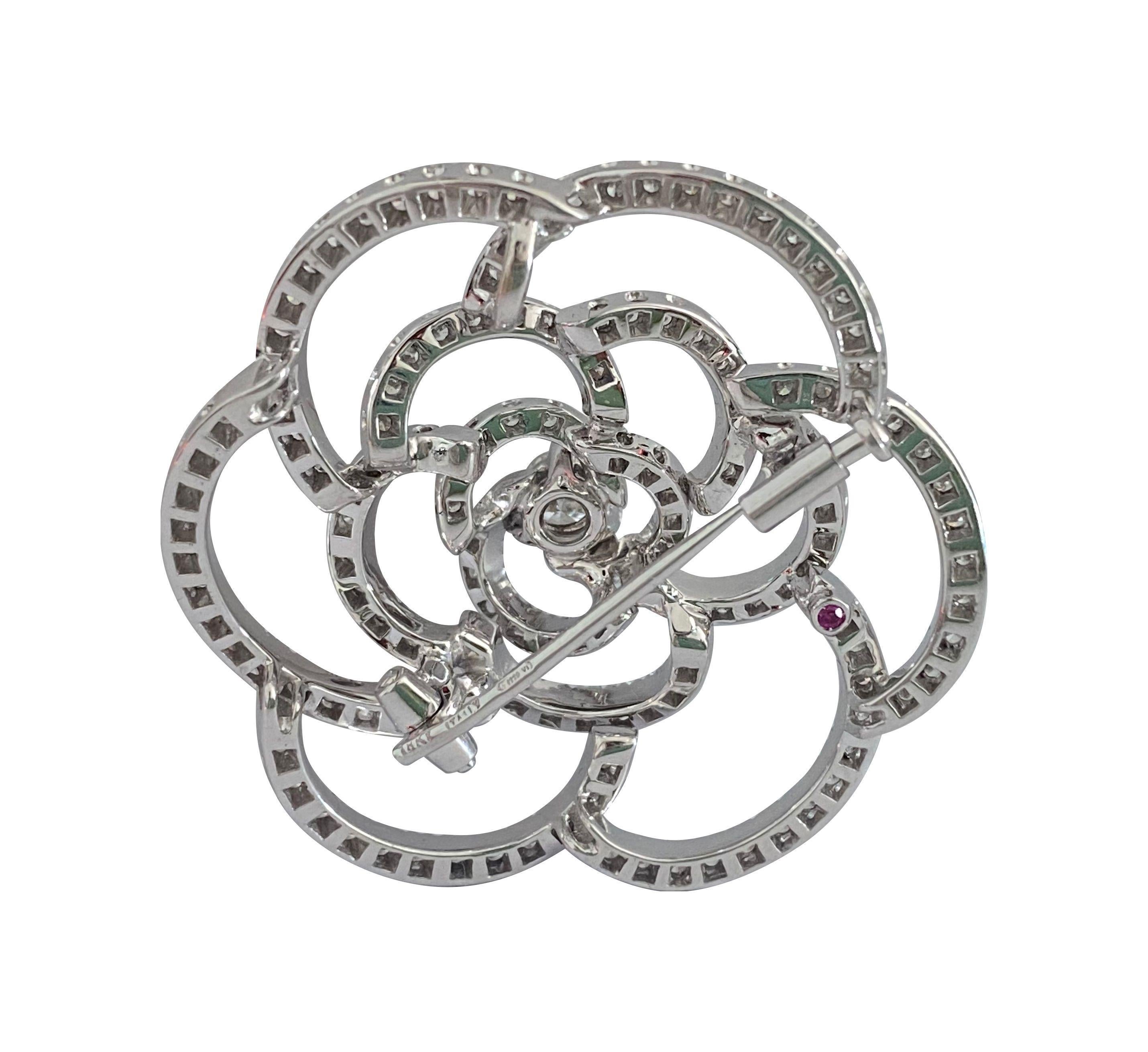 Crafted from 18k white gold, this exquisite diamond pin features a total carat weight of 5.50 carats of round brilliant-cut diamonds. With VVS2-VS1 clarity and E-F color, these diamonds exhibit exceptional brilliance and quality. Made in Italy, this