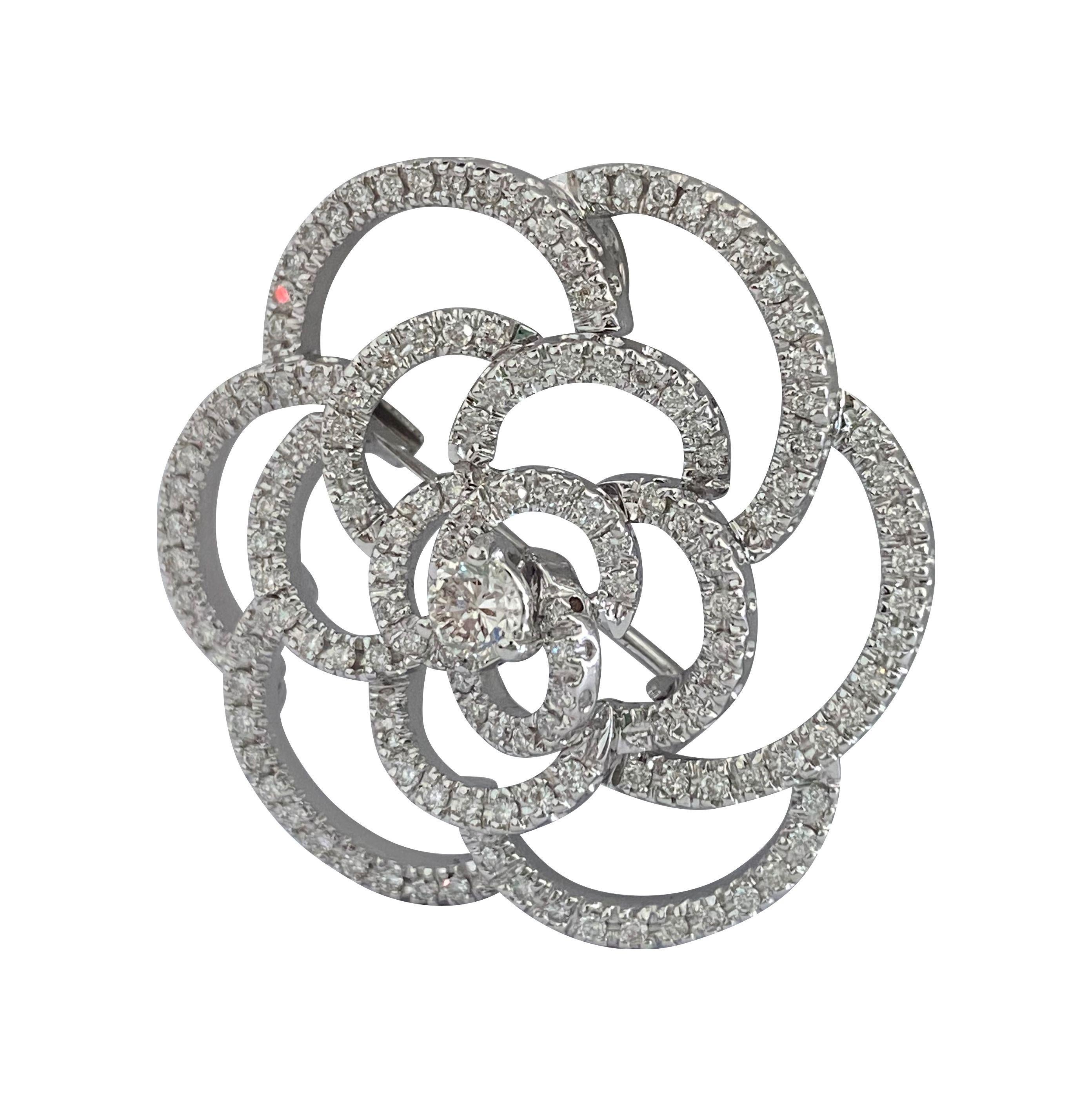 Crafted from 18k white gold, this exquisite diamond pin features a total carat weight of 5.50 carats of round brilliant-cut diamonds. With VVS2-VS1 clarity and E-F color, these diamonds exhibit exceptional brilliance and quality. Made in Italy, this