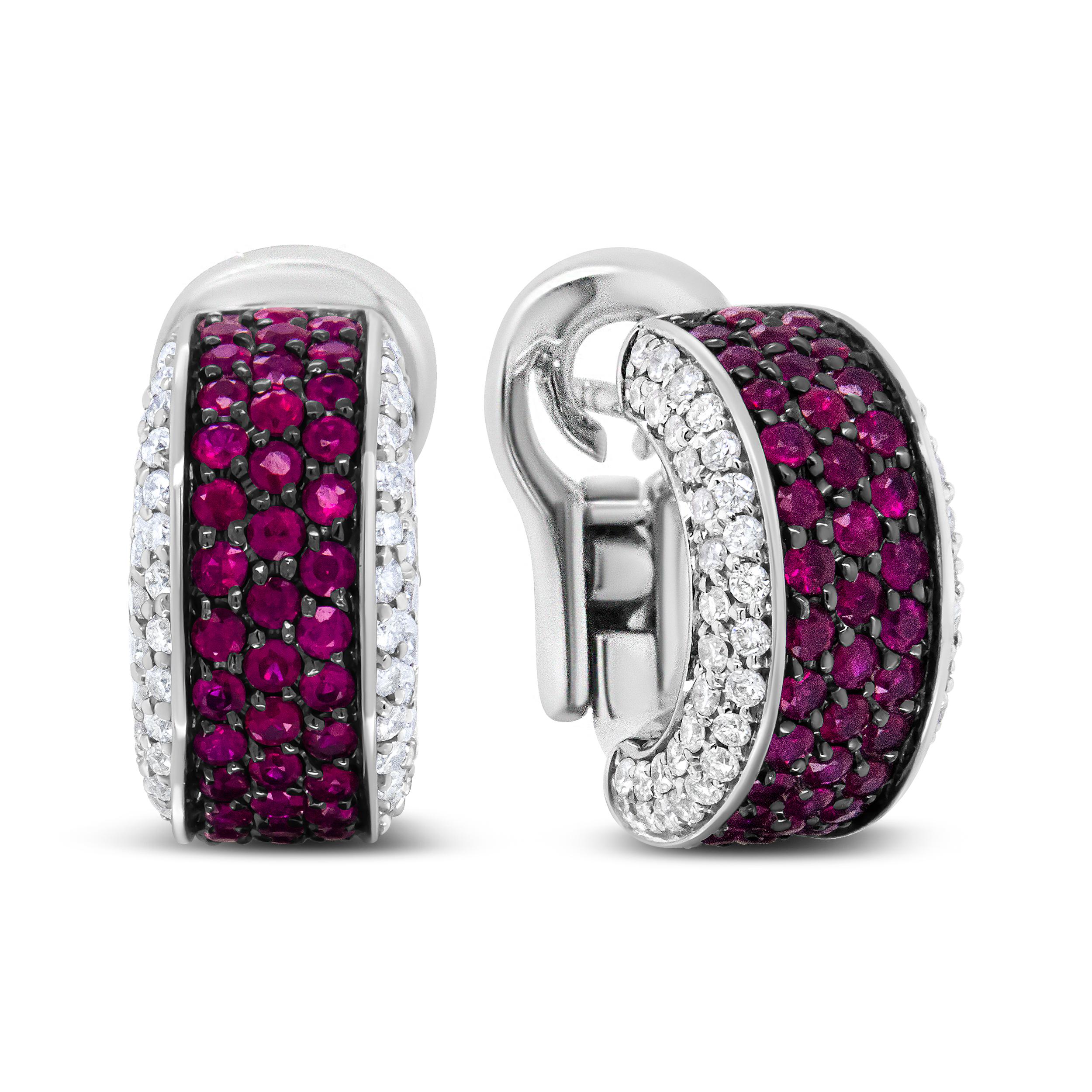 These huggie earrings provide stunning sparkle in the form of round white diamonds in prong settings and bring about a dazzling depth of color thanks to rows of brilliant-cut 1mm round natural red rubies. The diamonds that flank these deep red