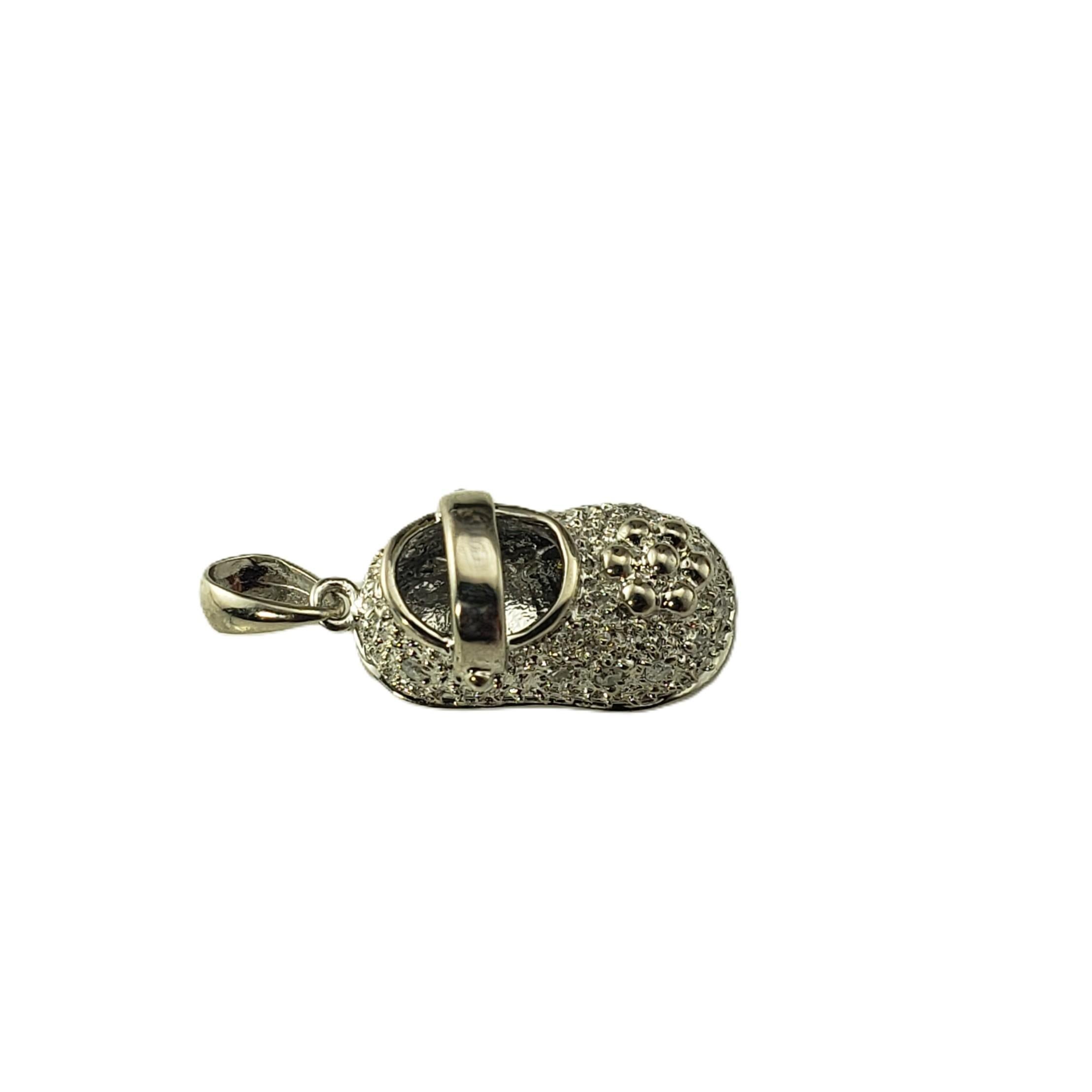 18K White Gold and Diamond Baby Shoe Charm

This finely crafted baby shoe charm is crafted in 18K white gold and adorned with 14 sparkling single cut diamonds. Perfect as a meaningful keepsake for new parents, a baby shower gift, or a sweet addition
