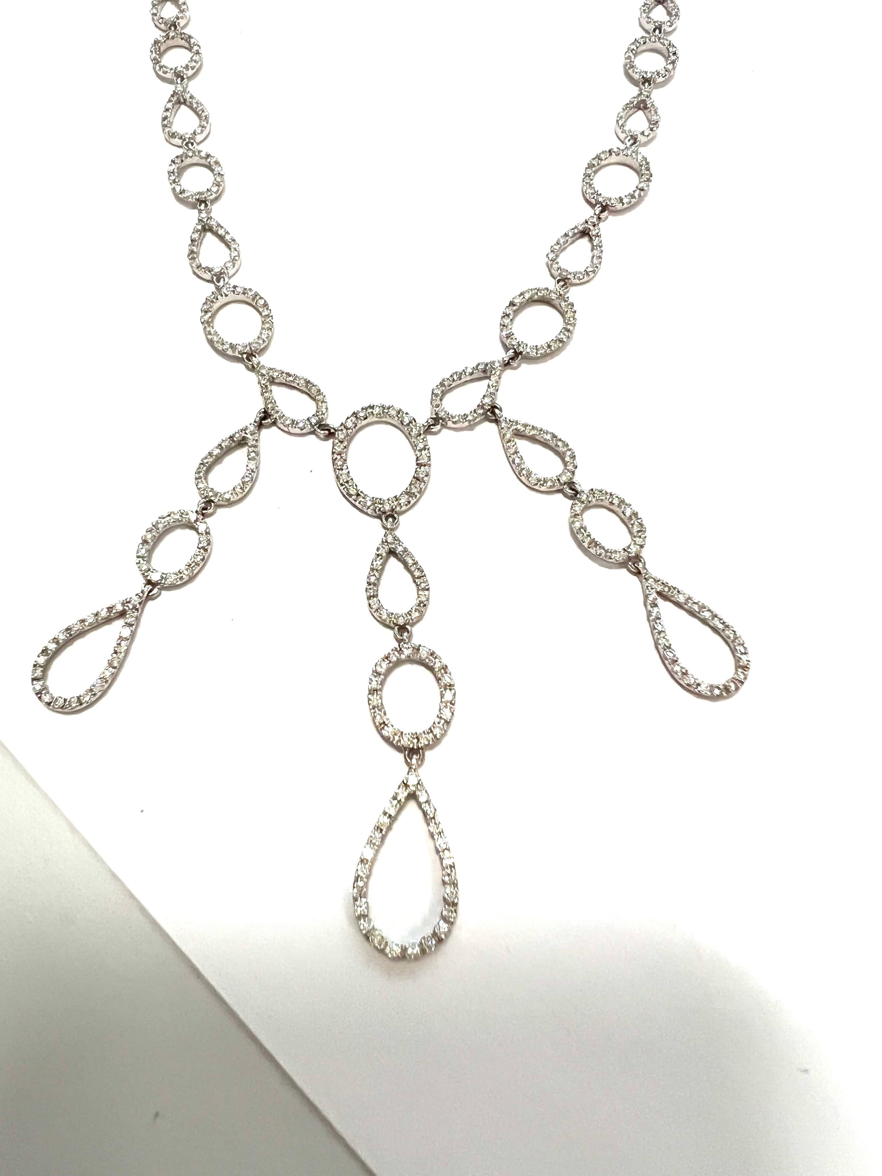 18k white gold and diamond choker.
Romantic choker in white gold and diamond links with dangling drops.
Total gold weight gr.20.70 
373 Diamonds GVVS  ct.3.51
Length cm.39
Stamp 750 ITALY
 